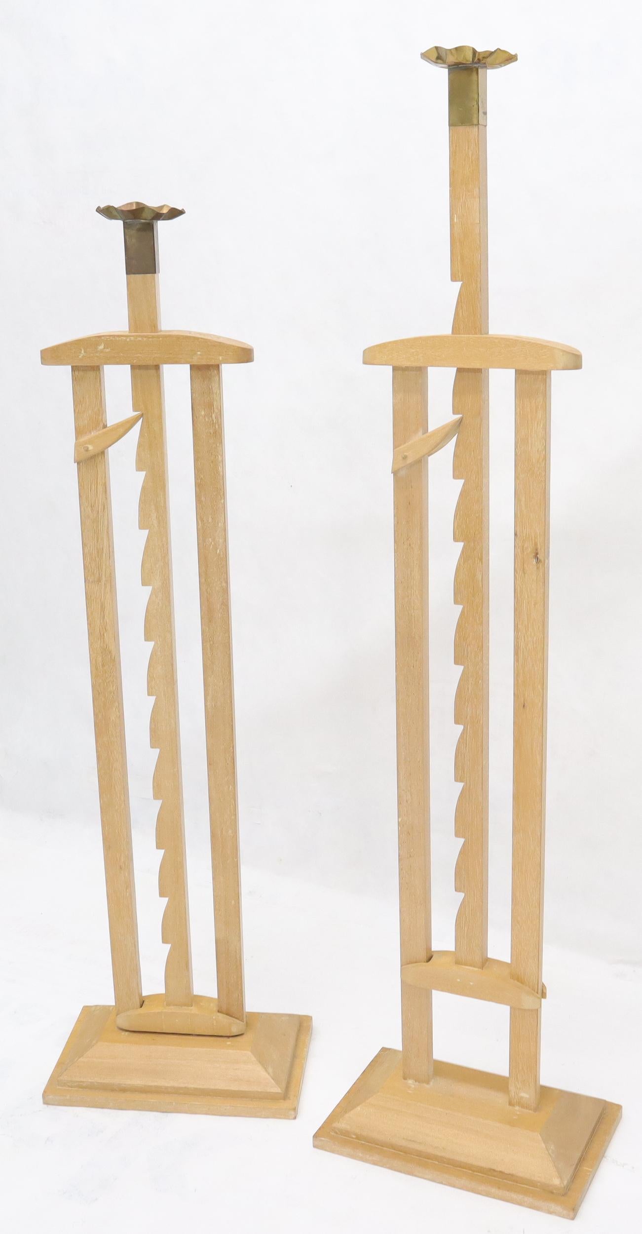 Pair of large adjustable candle sticks.