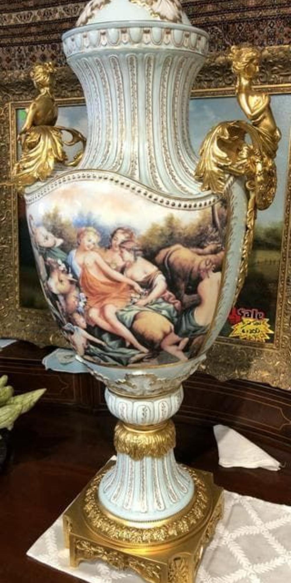 Pair Of Large Painted European Porcelain Urns with Gold Handles For Sale 1