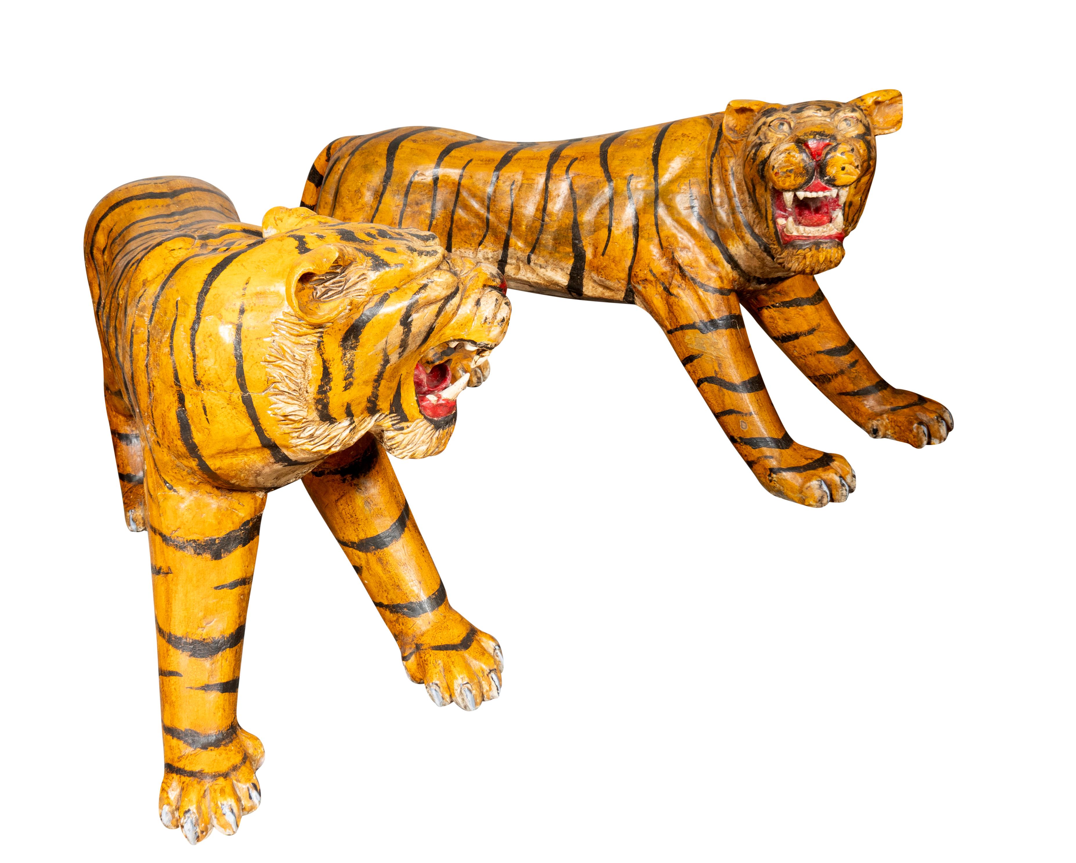 Life size tigers well carved and well painted possibly from possibly a circus, carnival or fair. 
True left and right. Exotic and fun would look great in an outside covered environment.