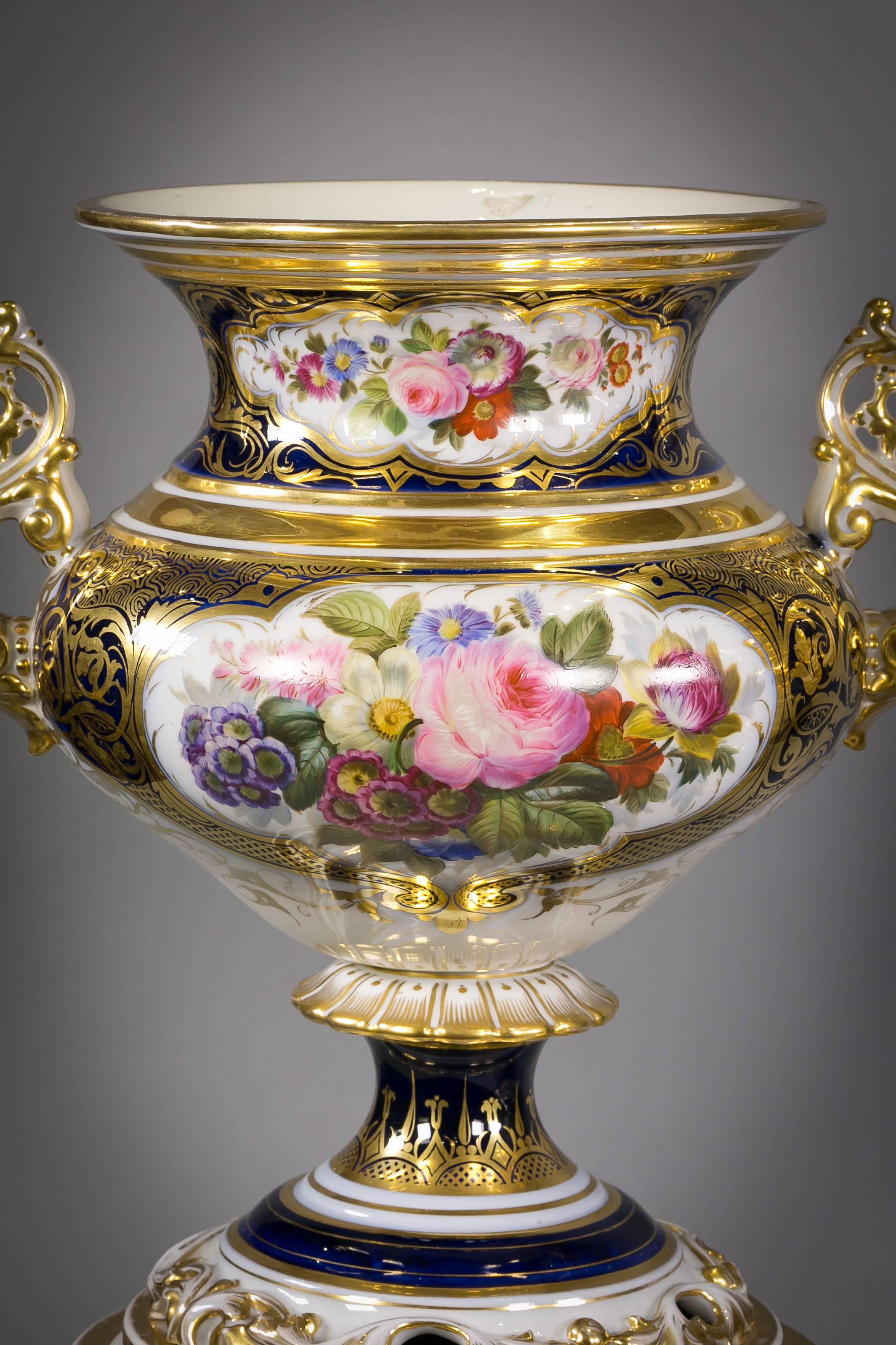 Pair of large Paris porcelain two-handled vases on plinths, circa 1860.