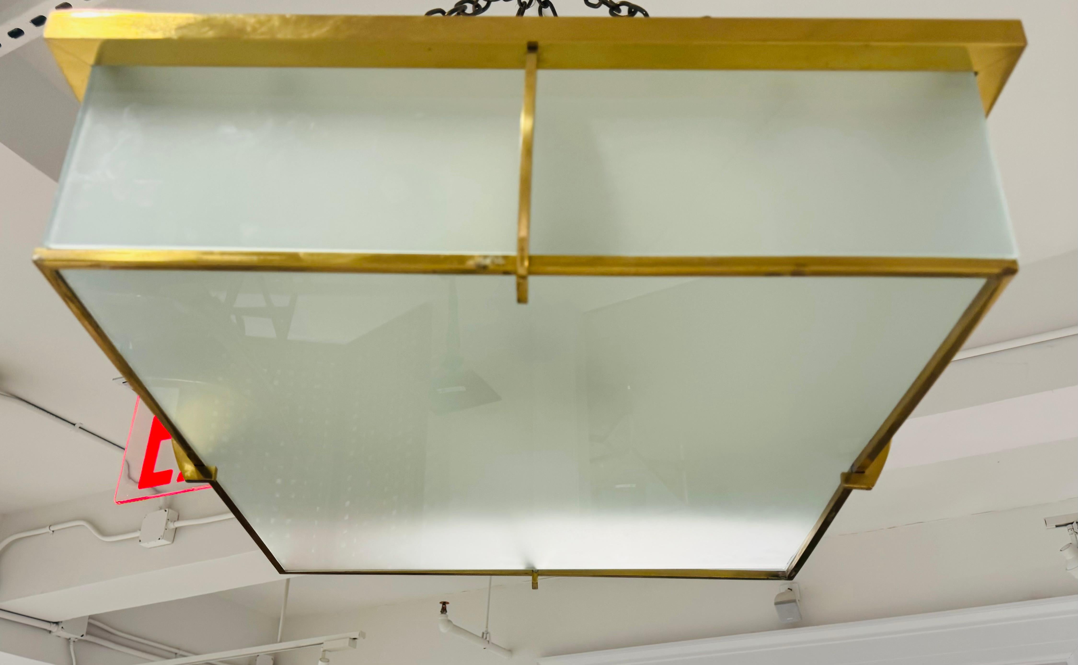 A pair of modern French Art Deco polished brass and frosted glass large flush ceiling lamps by famed lighting maker, Jean Perzel. Rewired 4 standard sockets. Can be sold individually at $4950 each.
