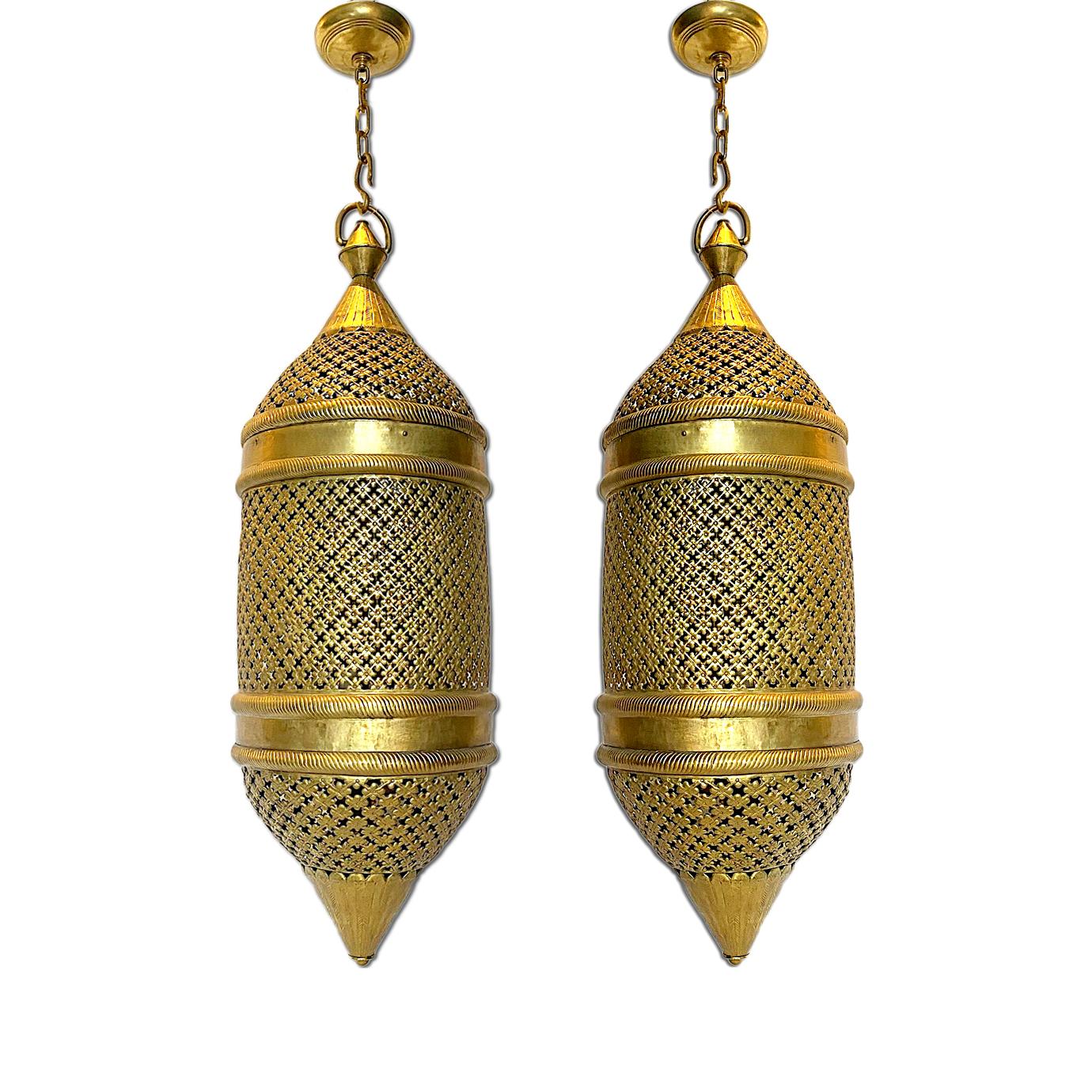A pair of circa 1940s hammered and pierced lanterns with four interior lights each. 
Sold individually.

Measurements:
Drop: 46