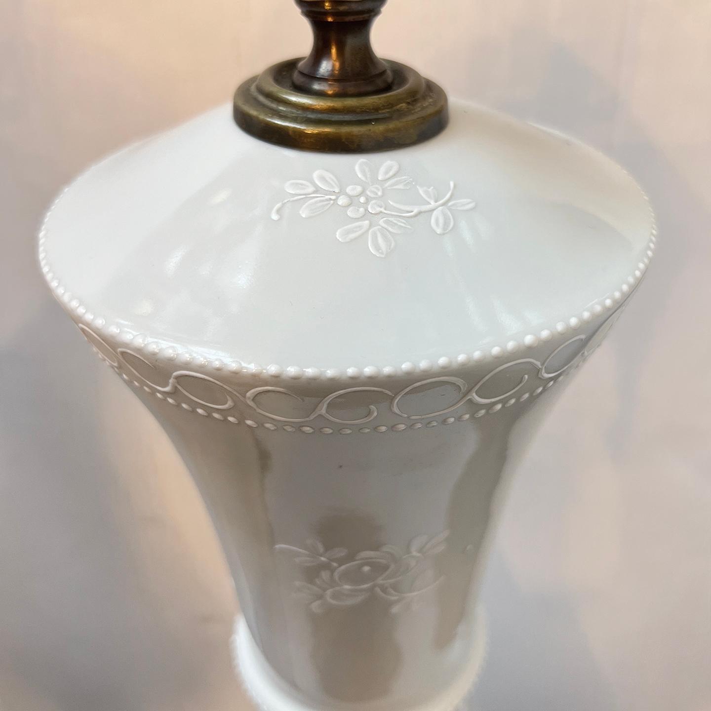 Pair of 1960's Danish porcelain table lamps with floral motif.

Measurements:
Height of body: 23.25