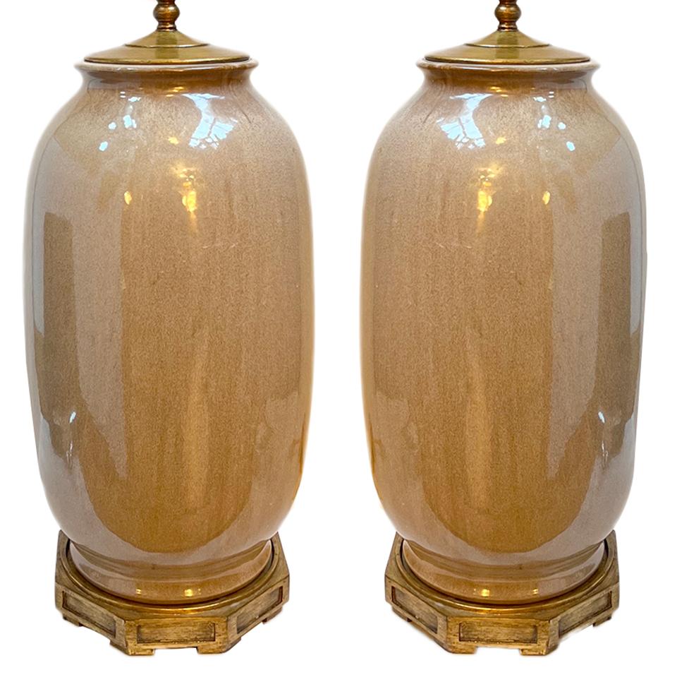 Pair of circa 1980's large French porcelain lamps with gilt bases.

Measurements:
Height of body: 19