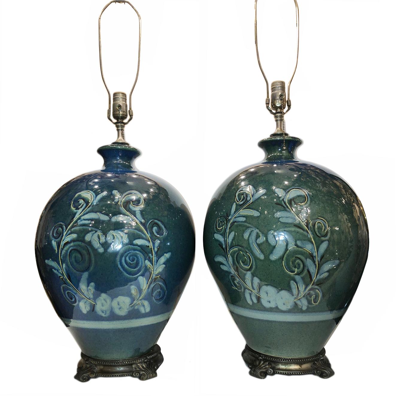 Pair of circa 1960s French hand painted porcelain lamps with silvered bronze bases.

Measurements:
Height of body 21