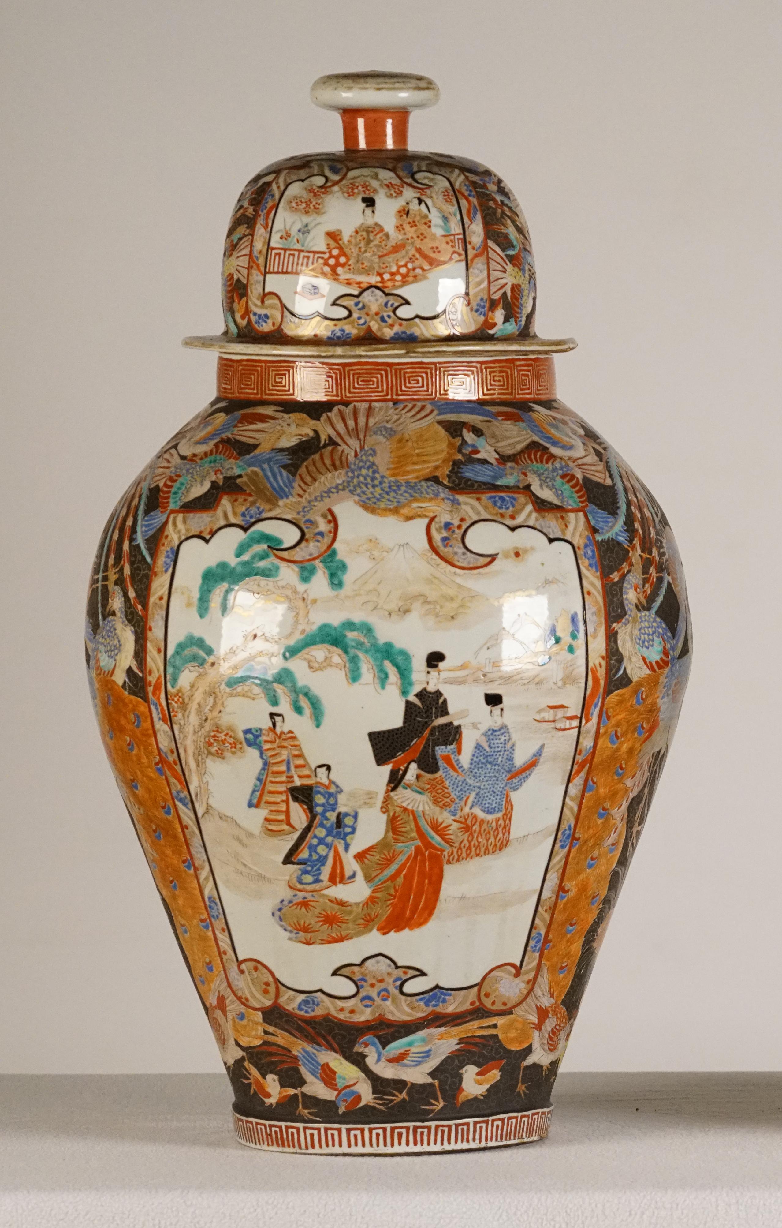 A Pair of Large Porcelain Vases
Kutani Period
Japan, Circa 1830

The covered baluster vases decorated in polychrome enamels and gilt over a clear glaze with panels of courtiers, the surrounding areas painted with various birds, the neck and foot