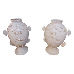 Pair of Large Relief-decorated Ivory-colored Glazed Ceramic Vases