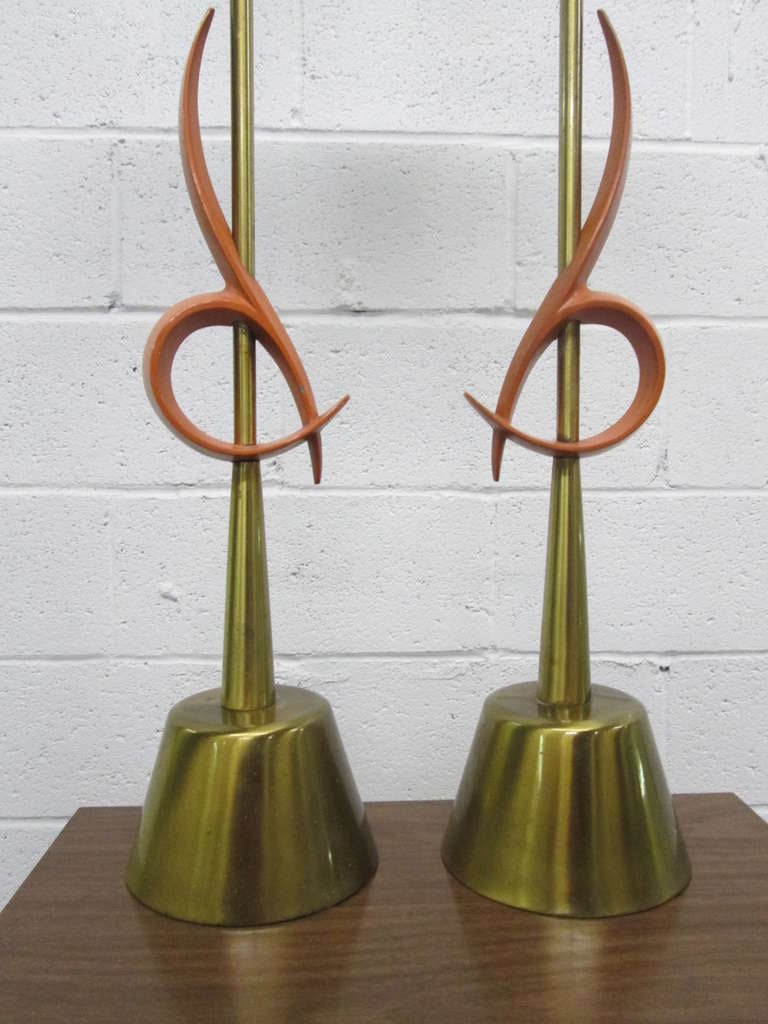 Pair of large Rembrandt table lamps with an orange abstract pattern and round brass base.
Measures: 39.5 height, base is 7 in diameter.
