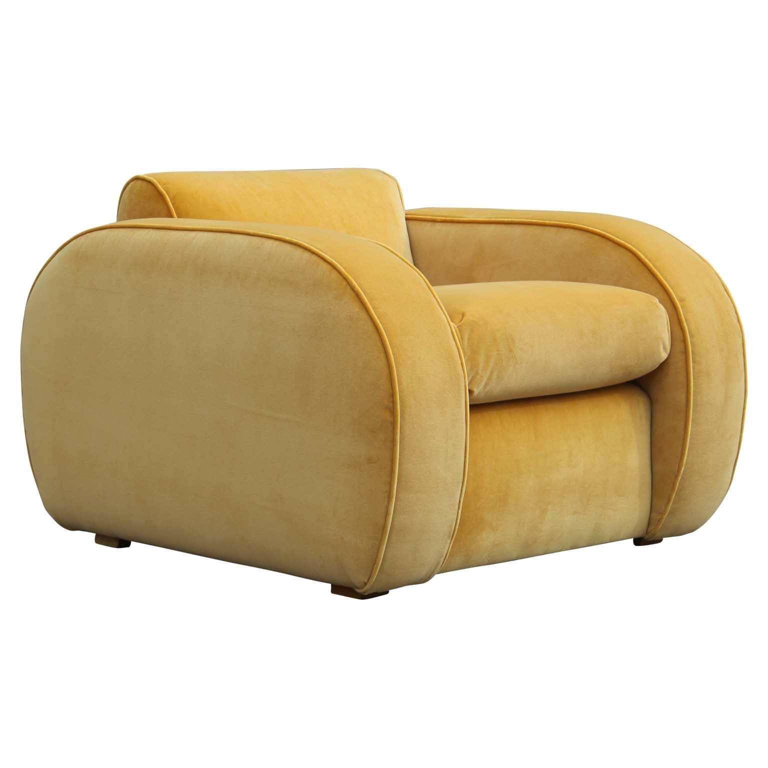 A pair of two beautiful large restored modern deco yellow velvet streamline club chairs.