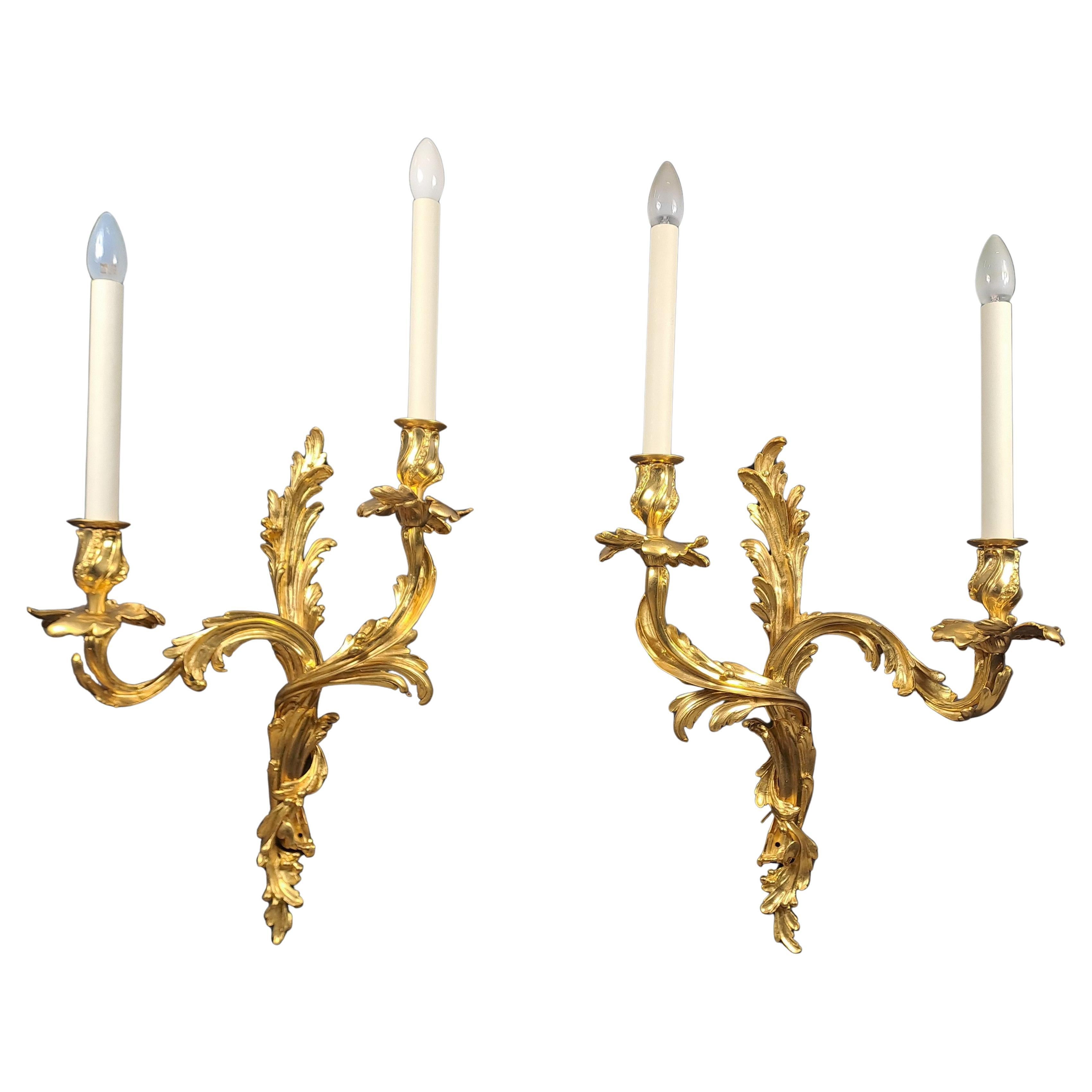 Pair Of Large Rocaille Wall Lights In Gilt Bronze