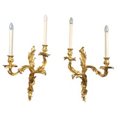 Pair Of Large Rocaille Wall Lights In Gilt Bronze