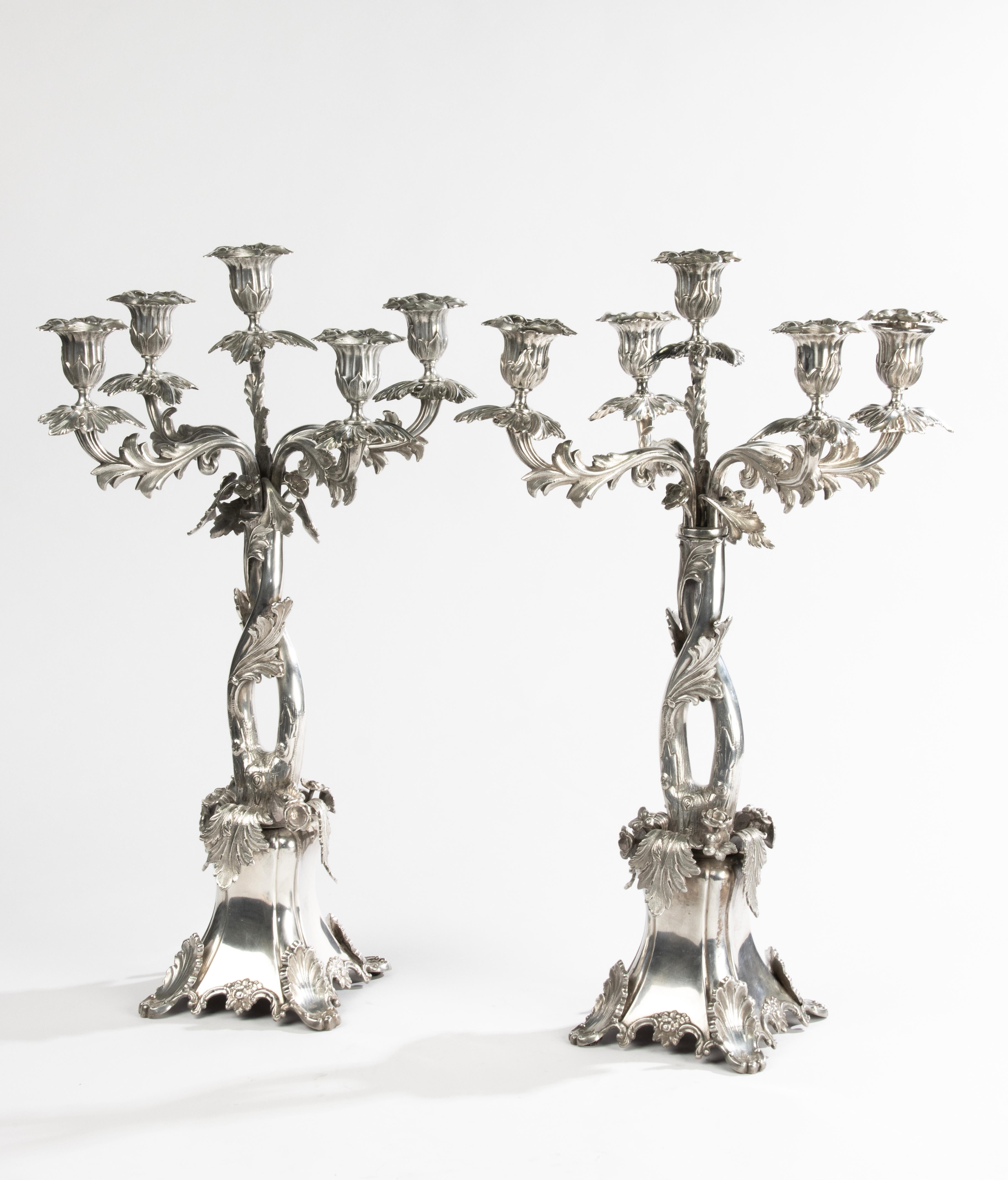 A striking and finely crafted pair of six-light candelabra in silver-plated nickel silver (marked 