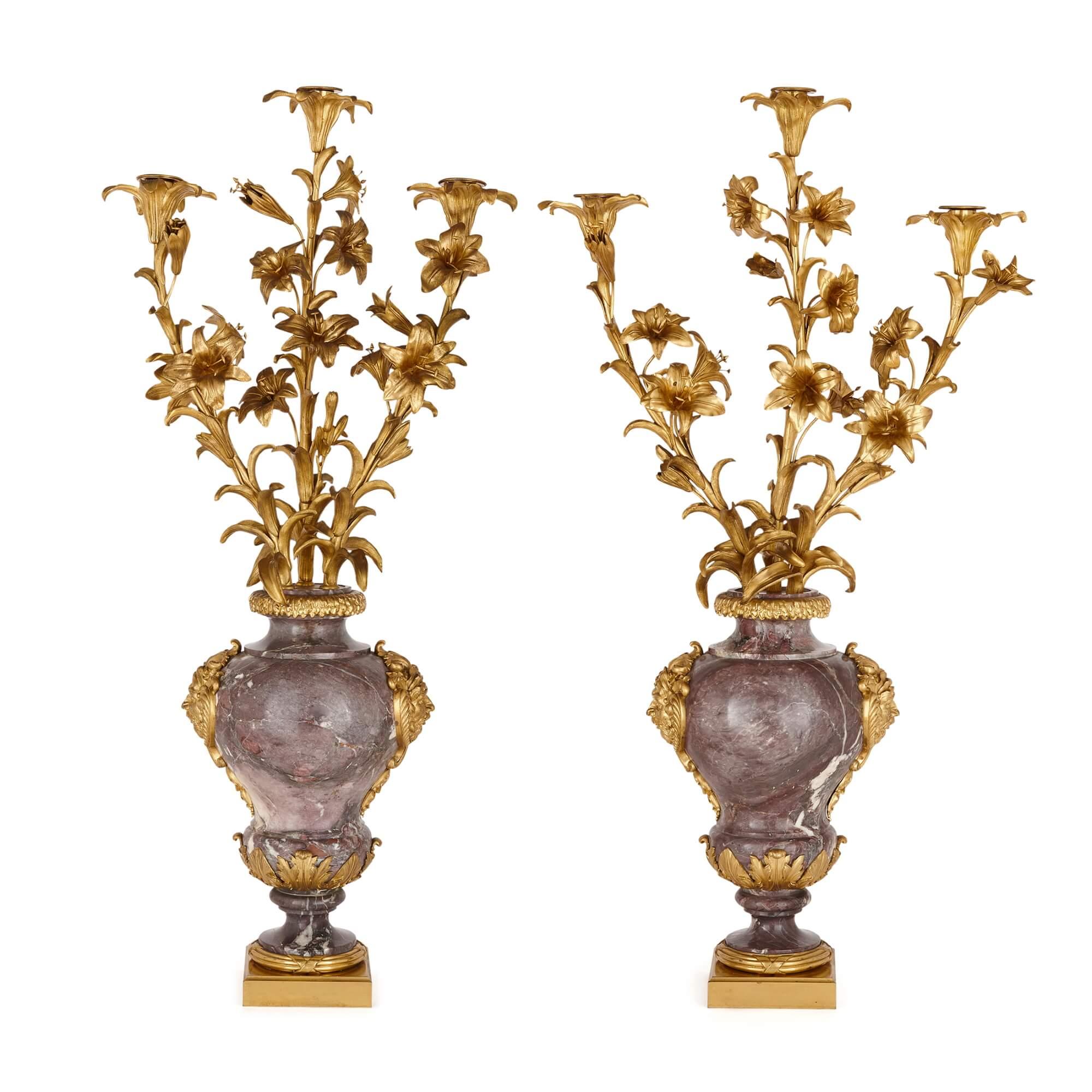 Pair of large Rococo style gilt-bronze and marble candelabra
French, Late 19th Century
Measures: height 106cm, width 46/53cm, depth 23cm

These superb antique candelabra were made in the late nineteenth century in the Louis XV or Rococo style,