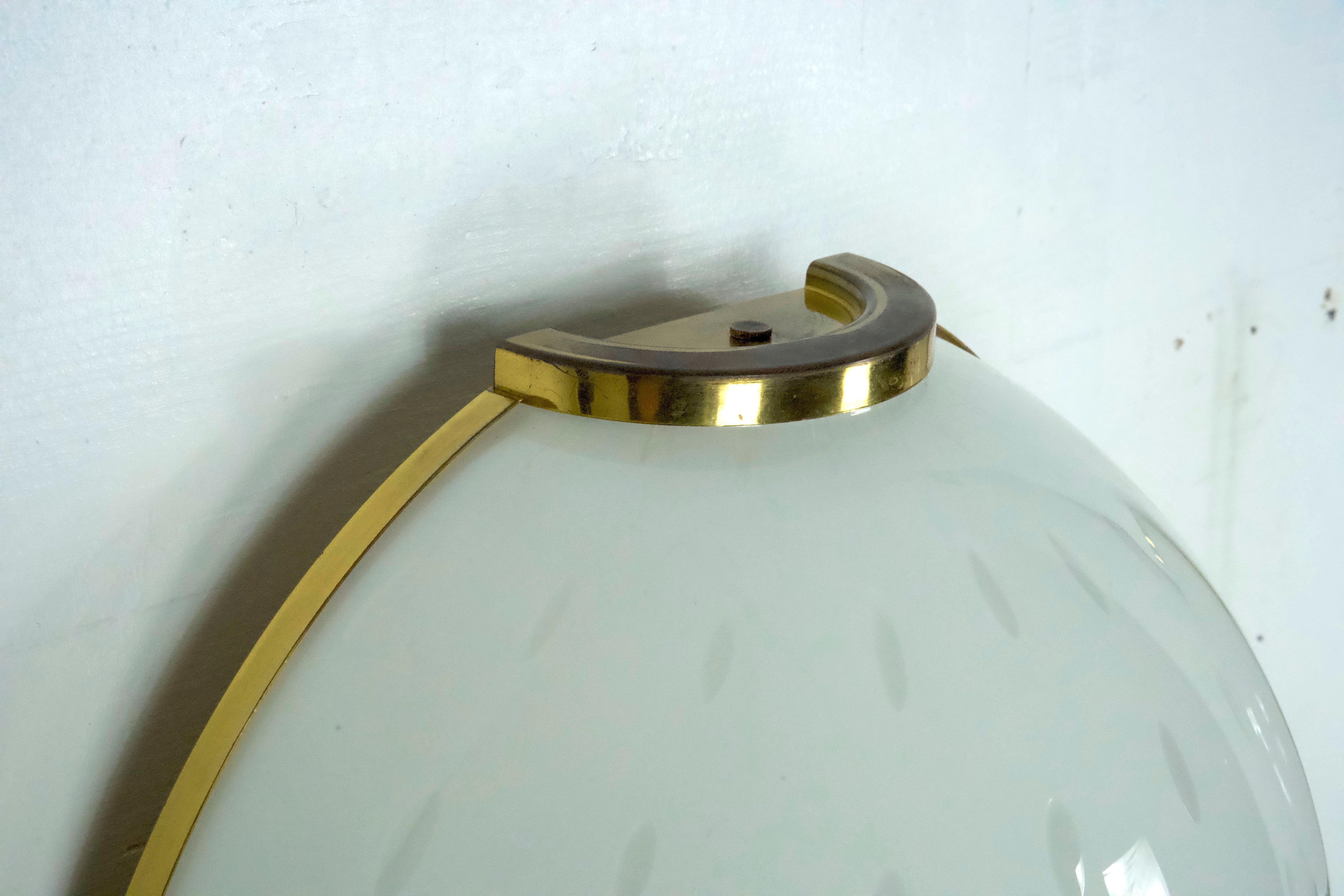 Brass Pair of large round murano bullicante glass sconces with brass. Italy 1970s For Sale