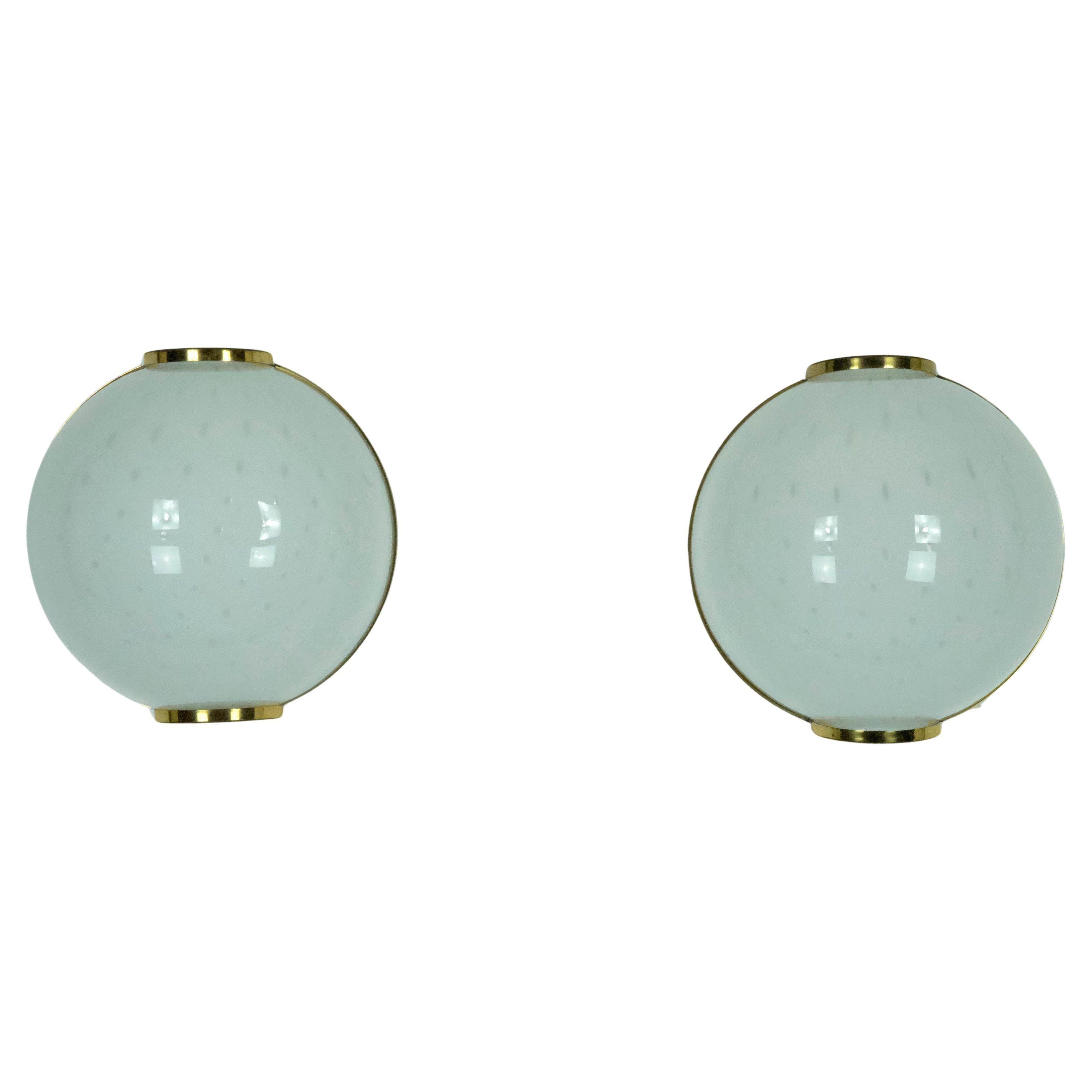 Pair of large round murano bullicante glass sconces with brass. Italy 1970s For Sale