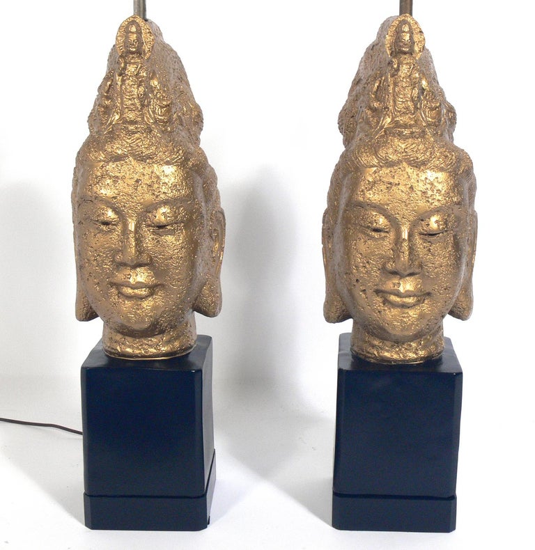 Pair of large Scale Asian style Guan Yin Buddha head lamps, American, circa 1960s. They have been rewired and are ready to use. The price noted below includes the shades.