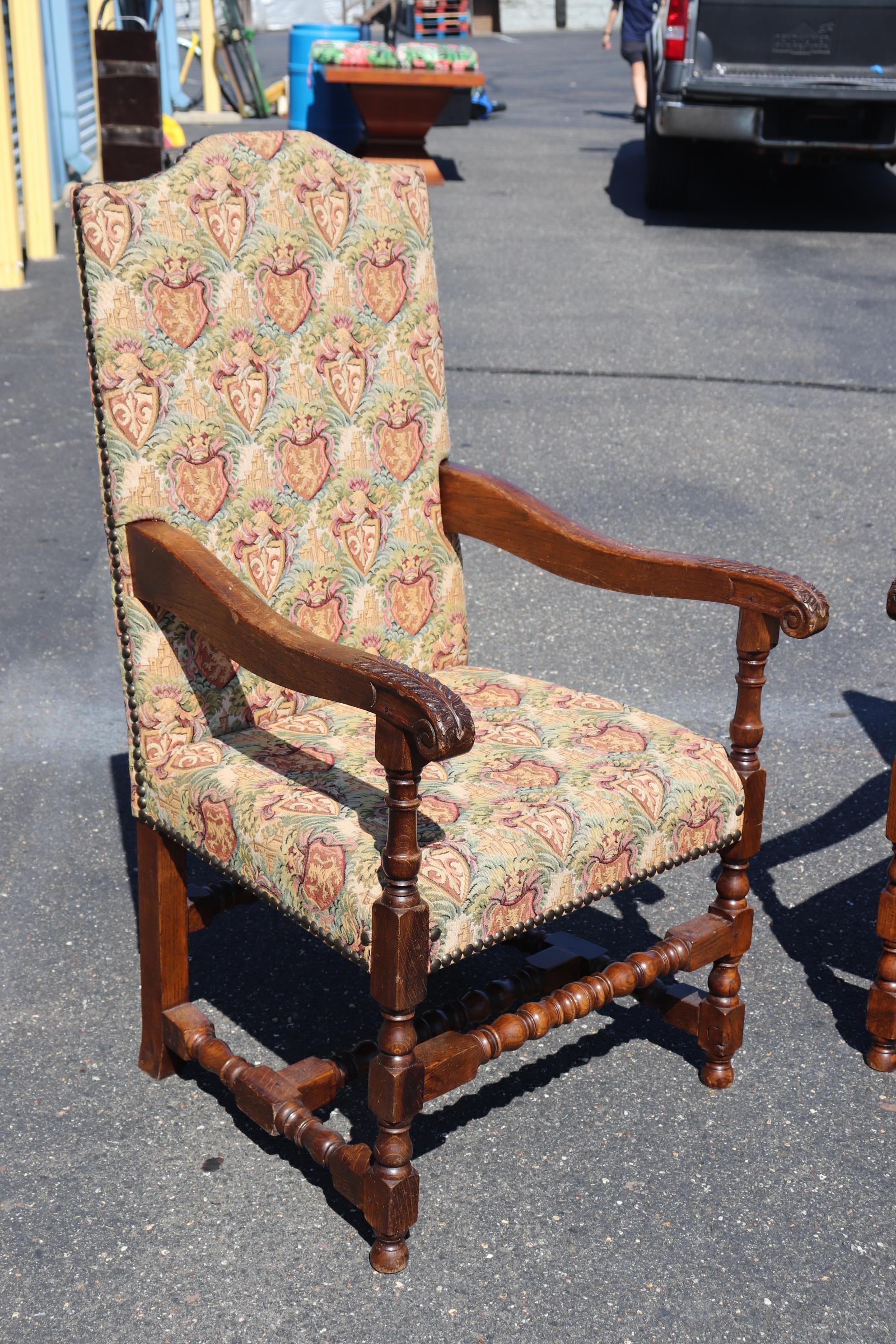 European Pair of Large Scale Carved Oak Tapestry Throne Head Dining Chairs circa 1950