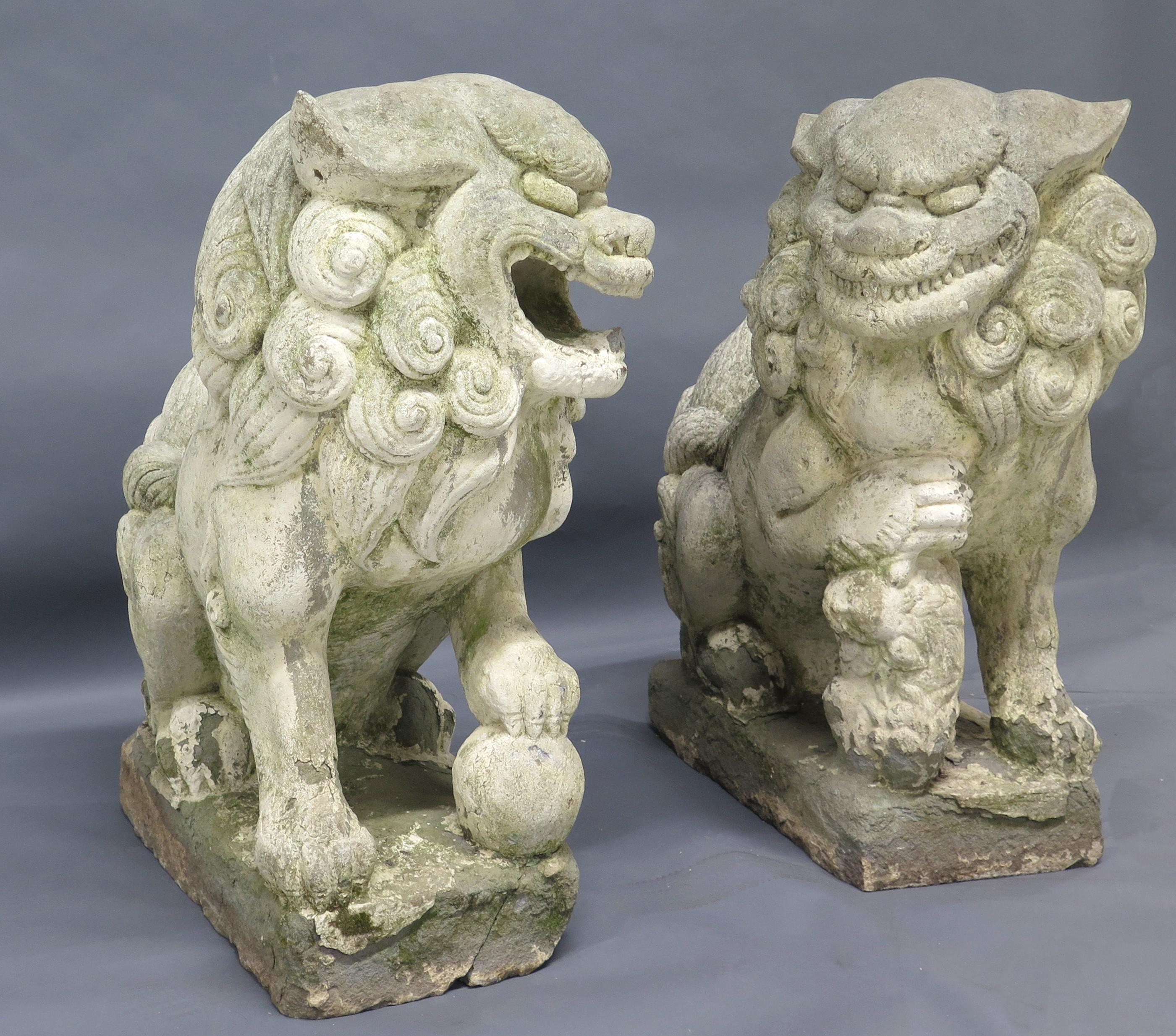 a pair of large scale, well carved stone Chinese Foo Dogs / Temple Lions, these are carved out of stone and are traditional Chinese architectural ornaments, China, circa 1920