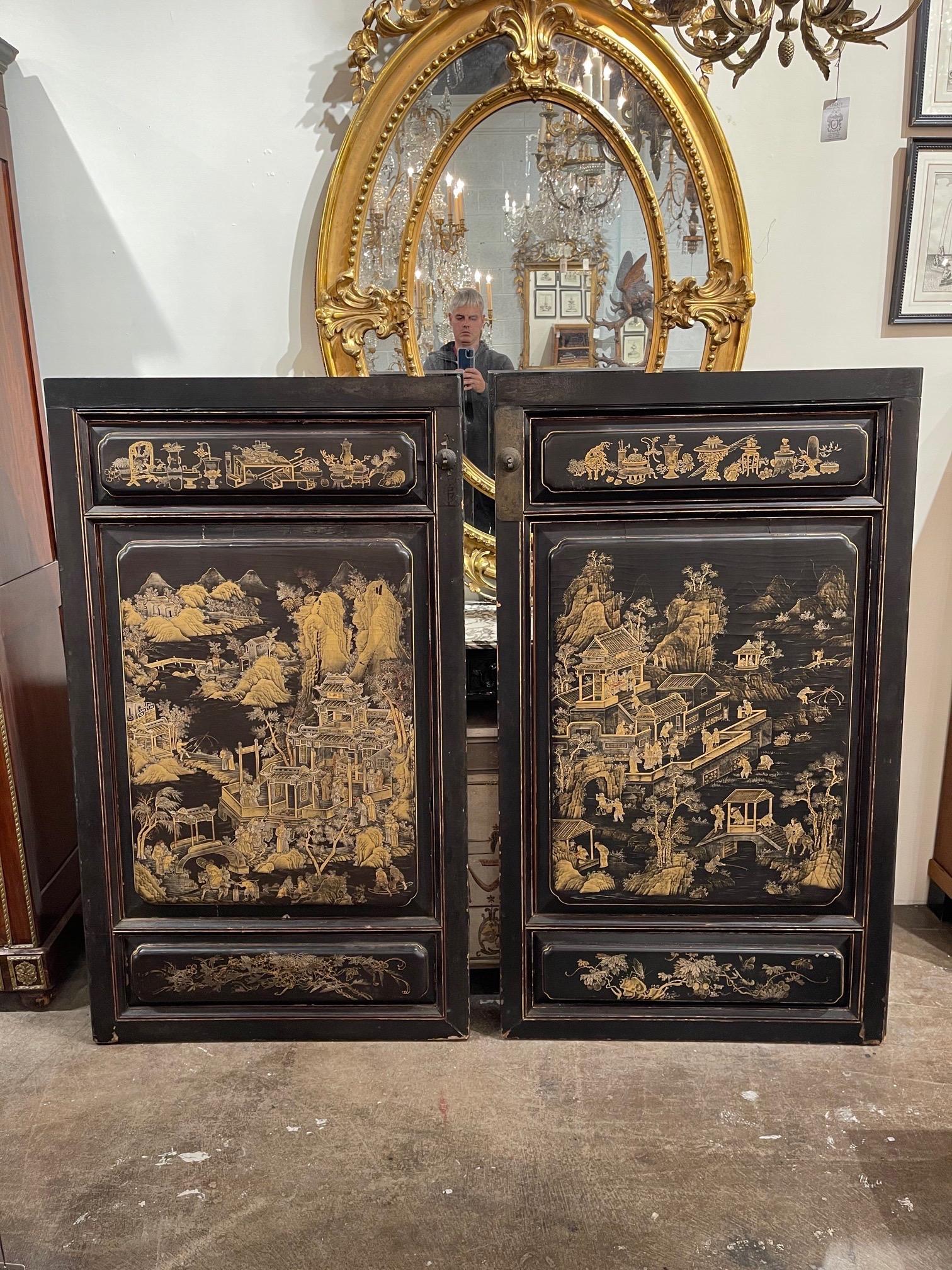 Decorative pair of large scale chinoiserie decorated wall panels. Interesting Asian scenes with amazing layers of detail on these. Makes a beautiful statement!