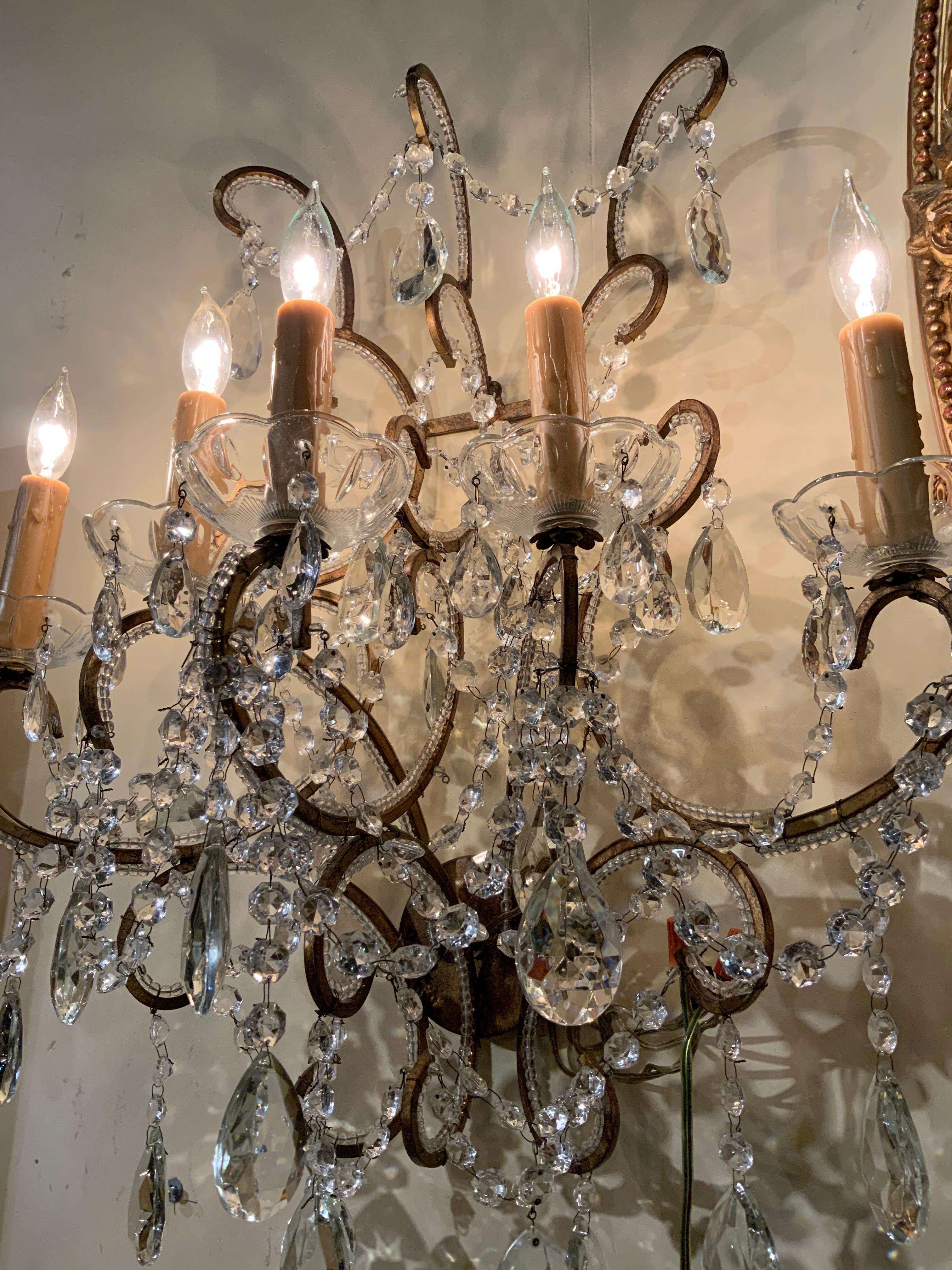 Large scrolling arms that are beaded makes this pair
Exceptionally nice. The crystal is clear and they have
Good wiring.