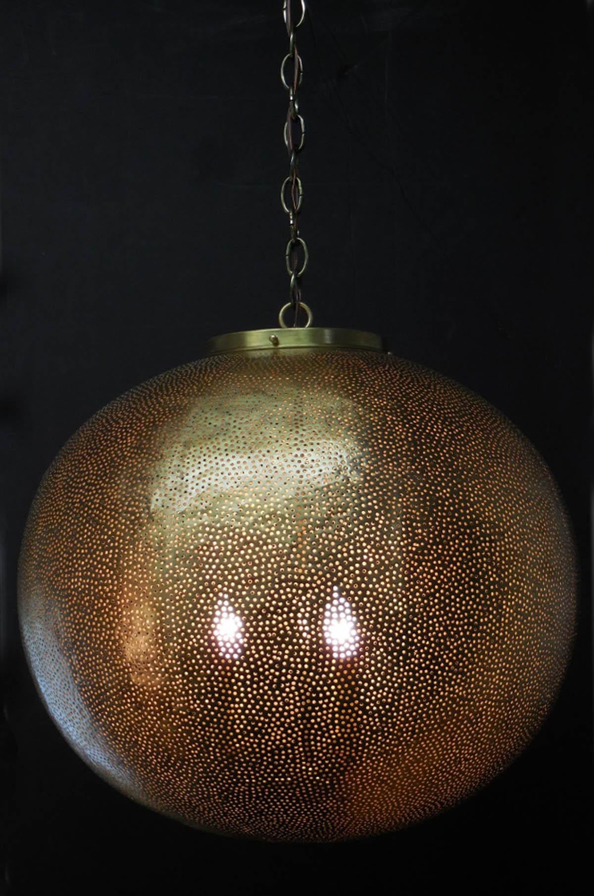 Large lantern, in hammered metal with hand finished matte bronze finish. Rewired in the US. Tiny circular cut outs. Three interior lights. Comes with chain in antique bronze finish. Ready for installation! 