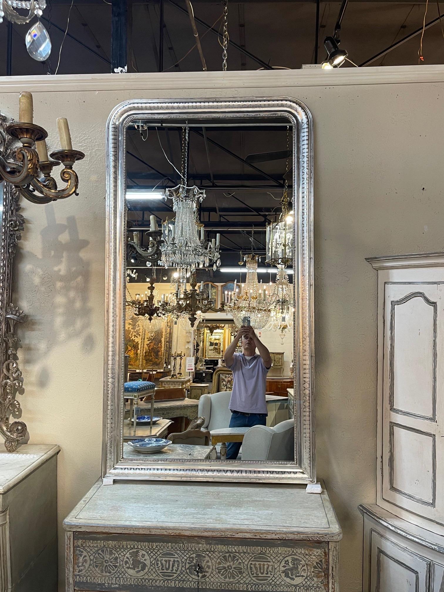Very fine pair of large scale silver Louis Philippe mirrors with x pattern. These also have a pretty beaded inner border. Makes a huge impact. Gorgeous!