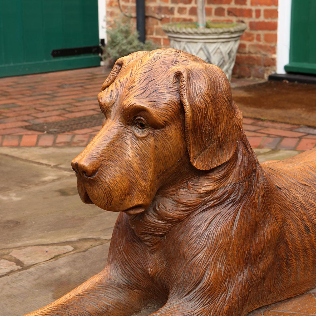 19th Century Pair of Large Scale Swiss Black Forest Carved Couchant Hunting Dogs For Sale