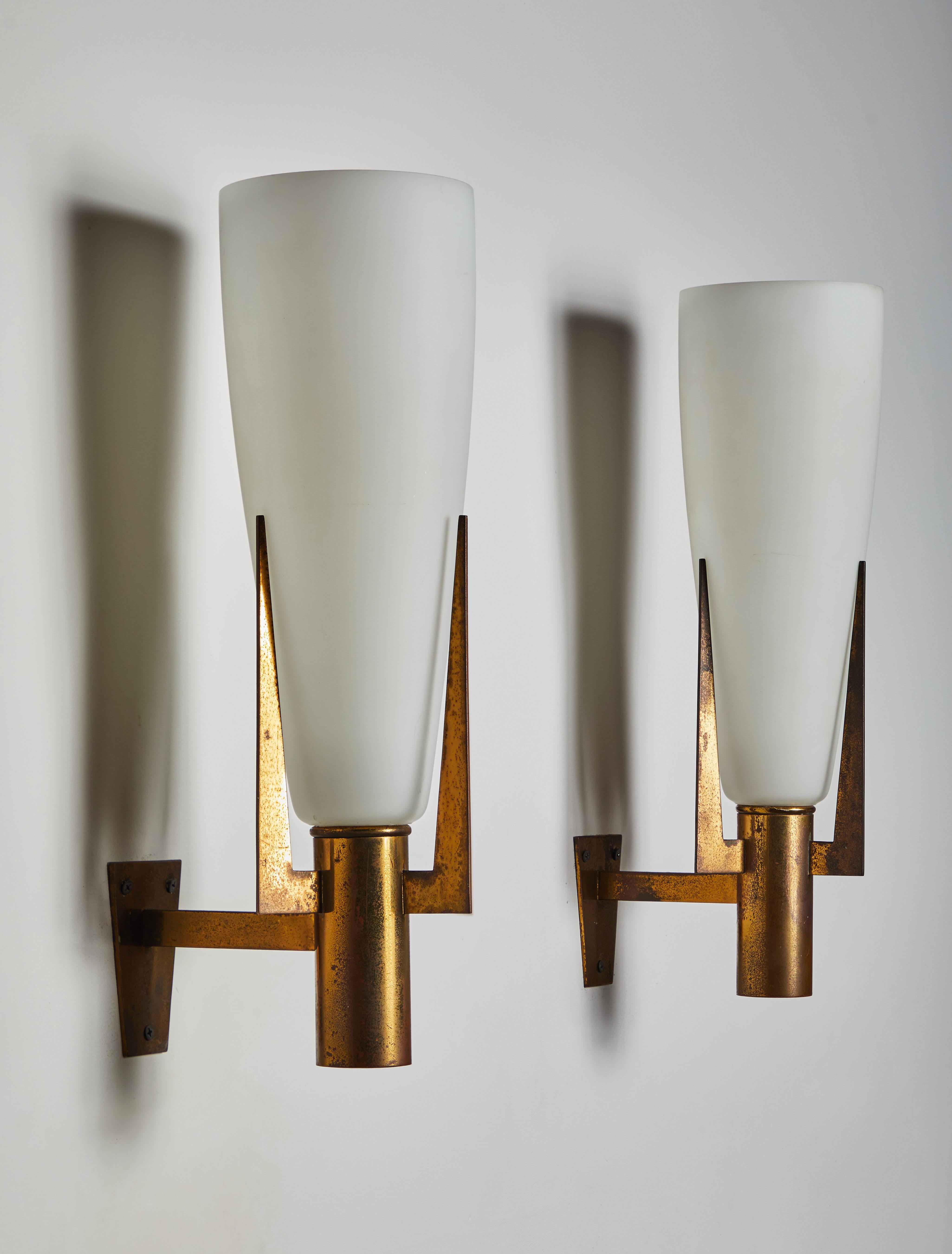 Pair of large sconces by Stilnovo. Manufactured in Italy, circa 1950s. Brass and brushed satin glass diffusers. Rewired for US junction boxes. Each sconces takes one E27 60w maximum bulb. Retains original manufacturer's label.
