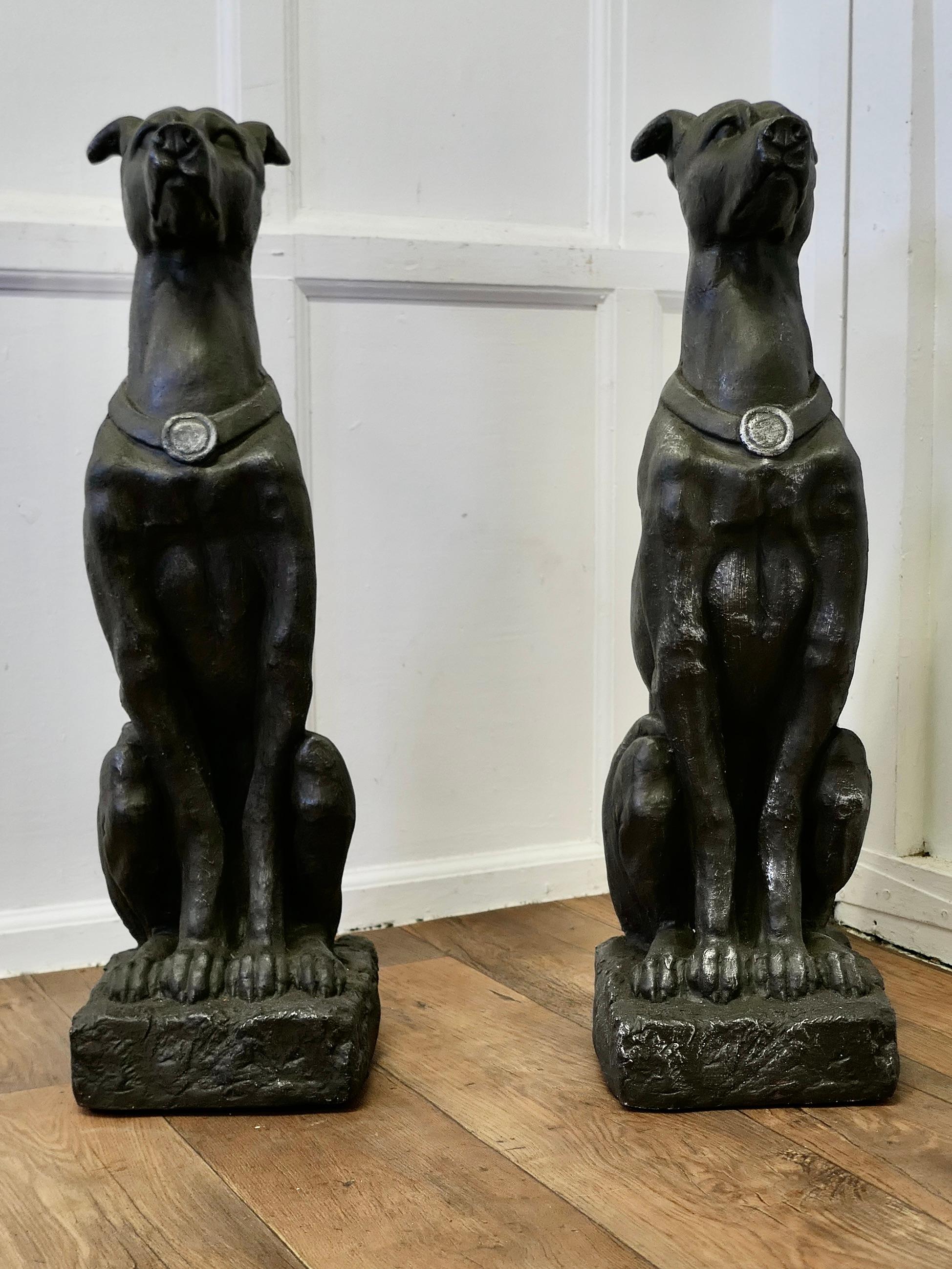 Pair of Large Sculptured Greyhound Dogs

This Super pair of Dogs has a good patina they appear to be made with an old polished steel finish
They are in very good condition with a beautifully aged patina

Greyhounds are 31” tall, and sit on a 10”