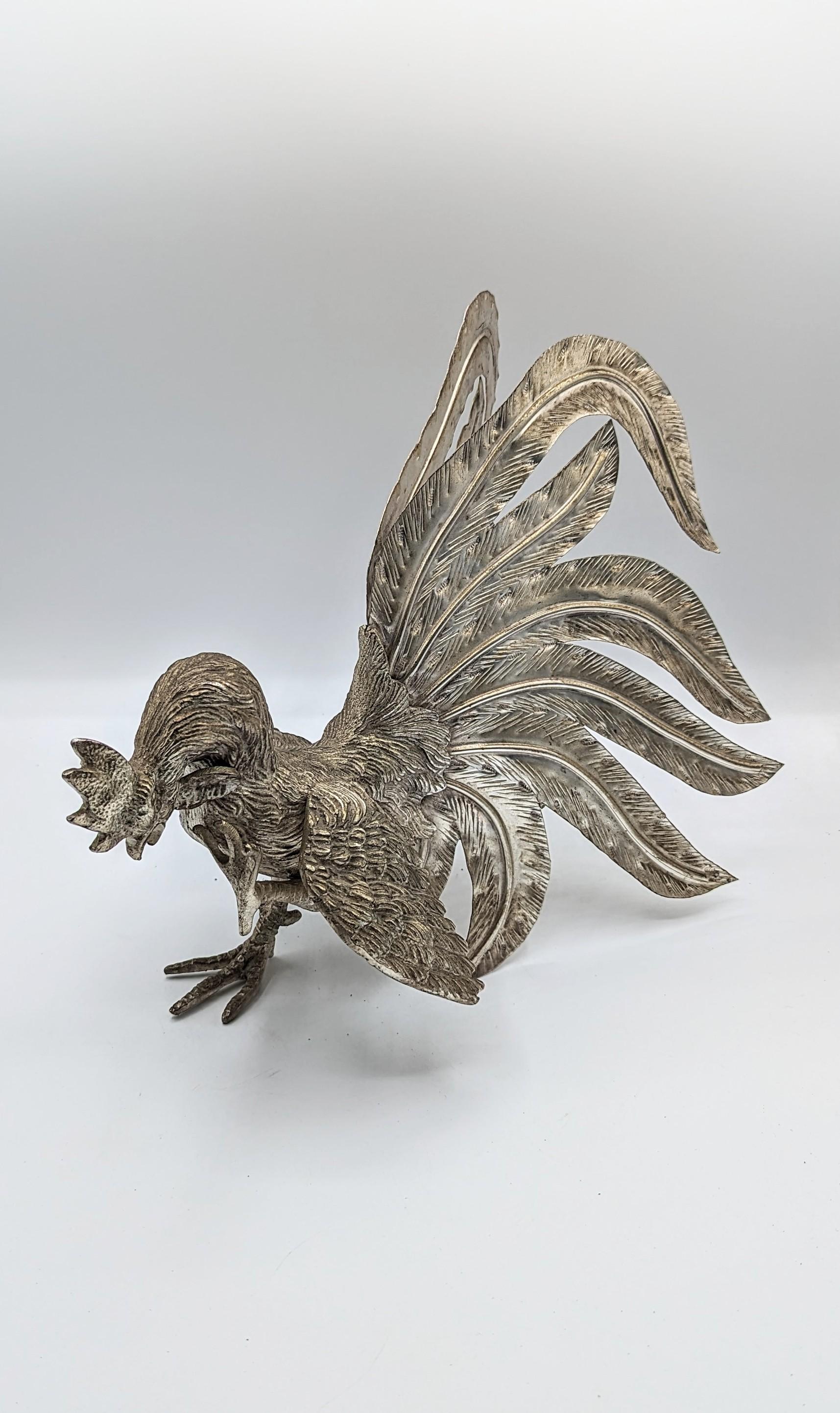 Rare and beautiful large silver plate roosters manufactured in France in 1960s.
Roosters in an attitude of fighting. These Fighting Cockerels are created with a wonderful attention to detail with close attention paid to the feathers and plumage.