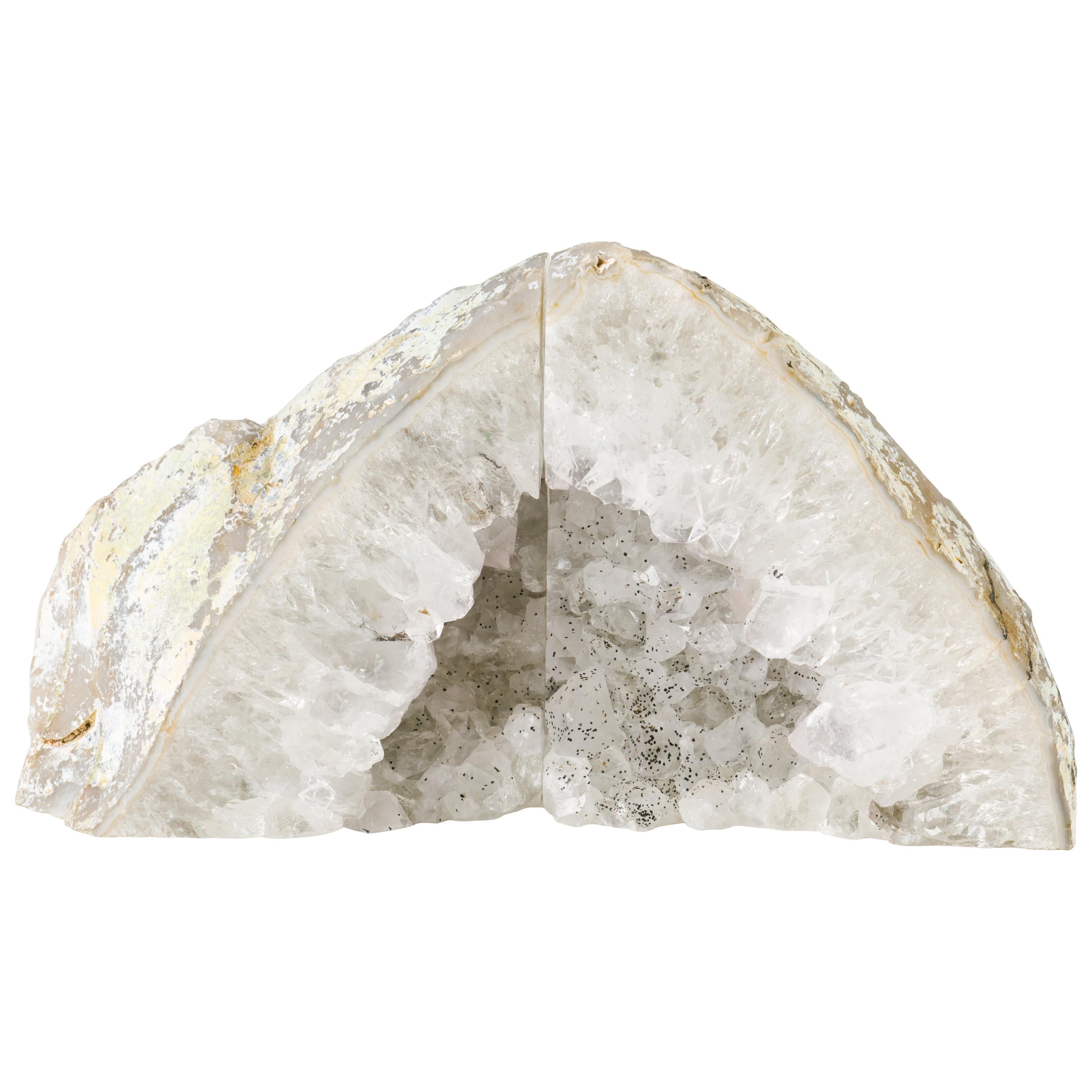 Pair of natural quartz crystal specimens with polished fronts and gorgeous rock crystal centres. The bookends have varying hues of white and silver and feature unusual speckles in gunmetal or black. Stunning from all angles and completely different