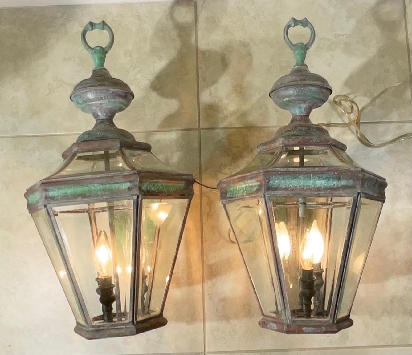 Elegant  Pair of vintage wall lantern, beveled glass ,made of solid brass beautiful patina, three 40/watt  lights  each lantern, suitable for wet location,
Decorative pair.
