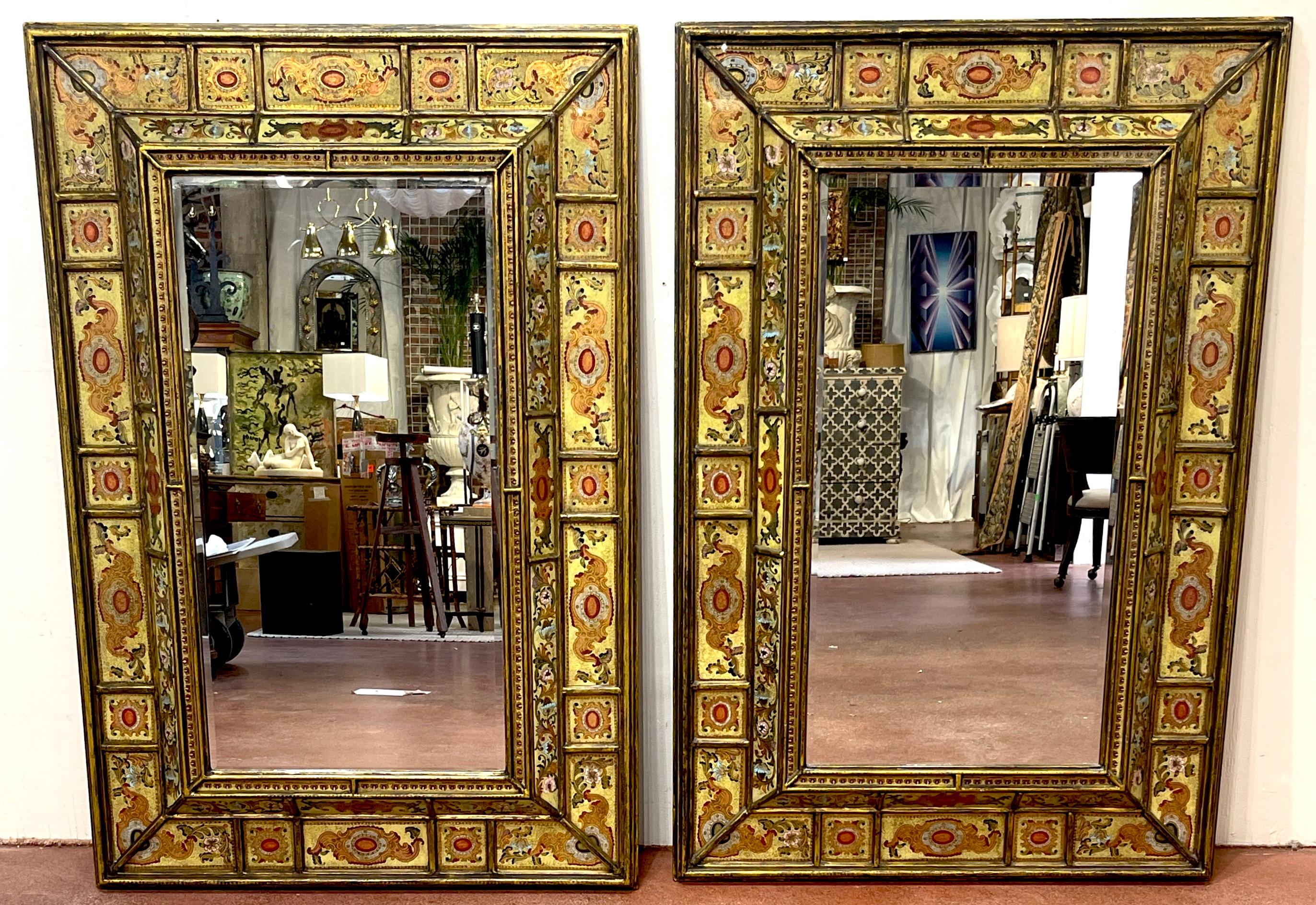 Pair of Large Spanish Colonial Eglomise Giltwood Mirrors 
Peru, Later 20th Century 

A magnificent pair of Spanish Colonial Eglomise Giltwood Mirrors, originating from Peru in the late 20th century. These mirrors exemplify the grandeur and