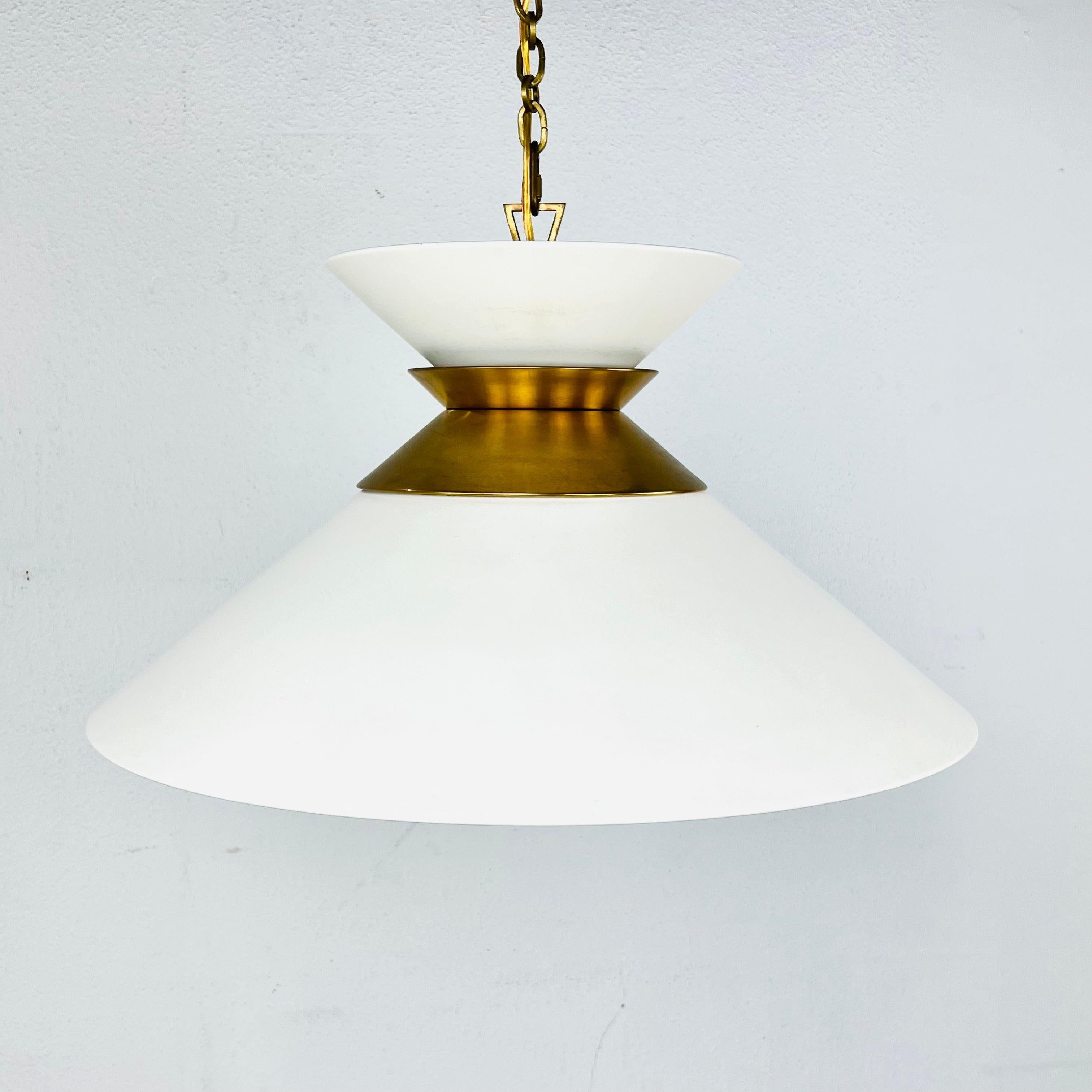 A dramatic new rendition of the classic barn light! This large stacked pendant by Visual Comfort Signature, formerly known as Visual Comfort, blends sharp angles with an open shade and sleeve and collar frame to create visual interest while