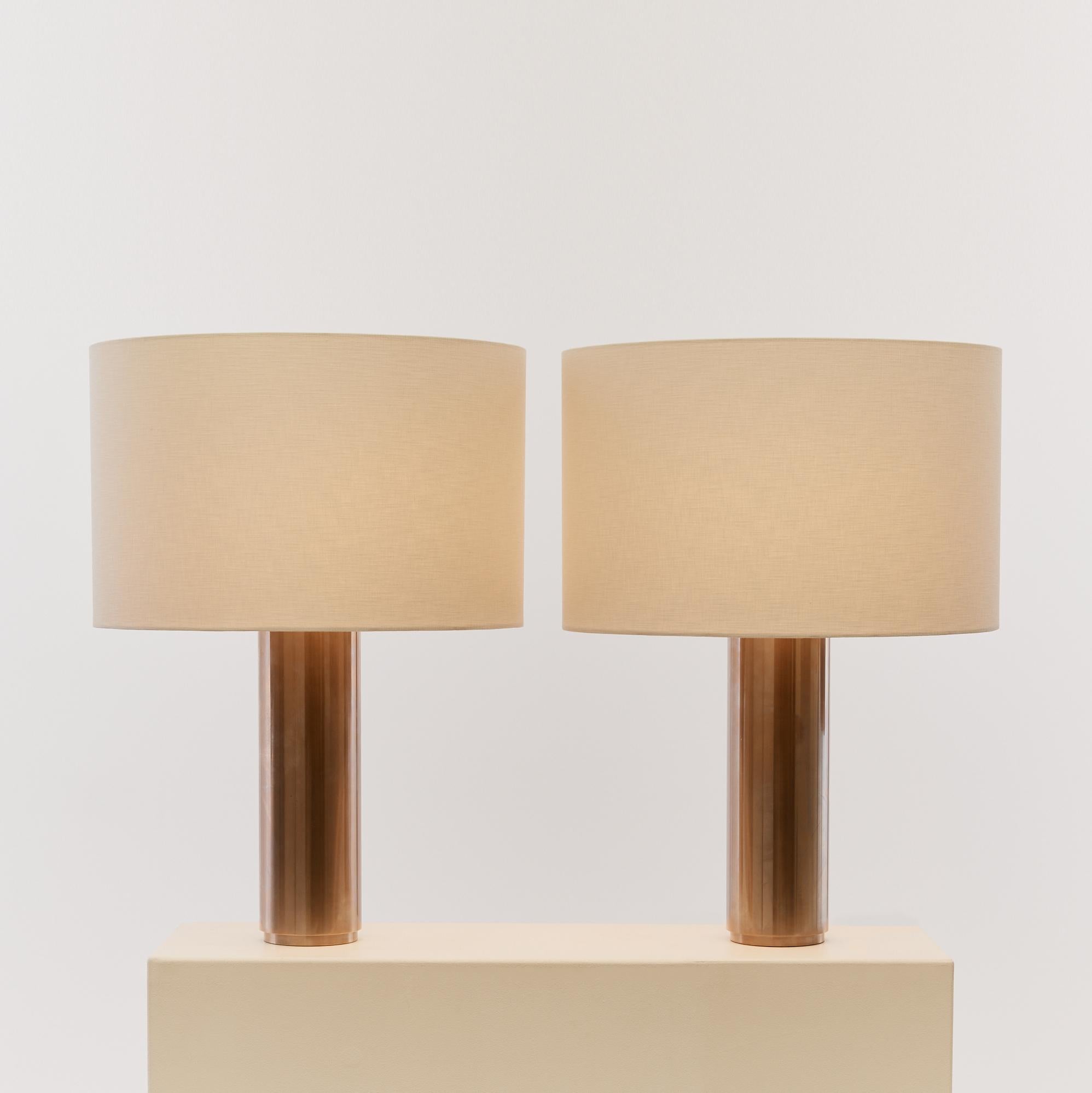 This pair of solid steel lamps are large weighty and substantial. They are of great proportion, each featuring double bulbs and new textural linen cylindrical shade.

PAT tested, with UK plug.

Sold as a pair.

Origin: Germany

Material: Steel,