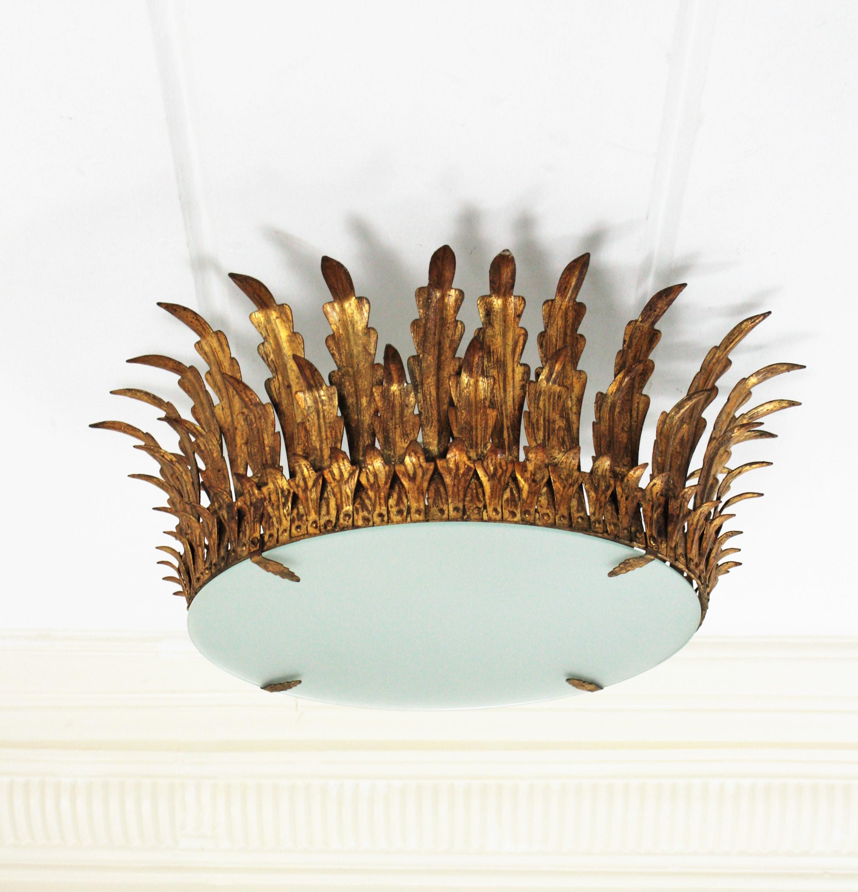 Mid-Century Modern Pair of Large Sunburst Crown Flush Mount Light Fixtures in Wrought Gilt Iron For Sale
