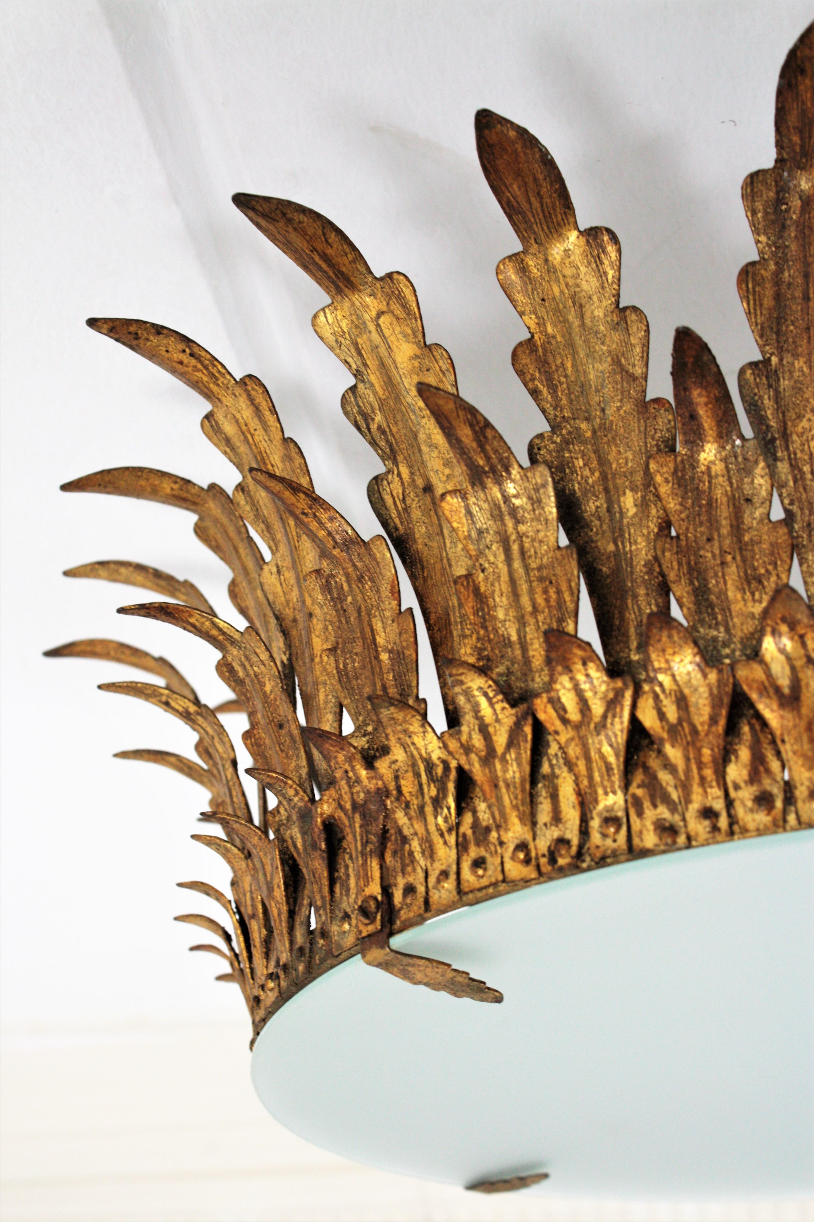 Spanish Pair of Large Sunburst Crown Flushmount Chandeliers in Wrought Gilt Iron For Sale