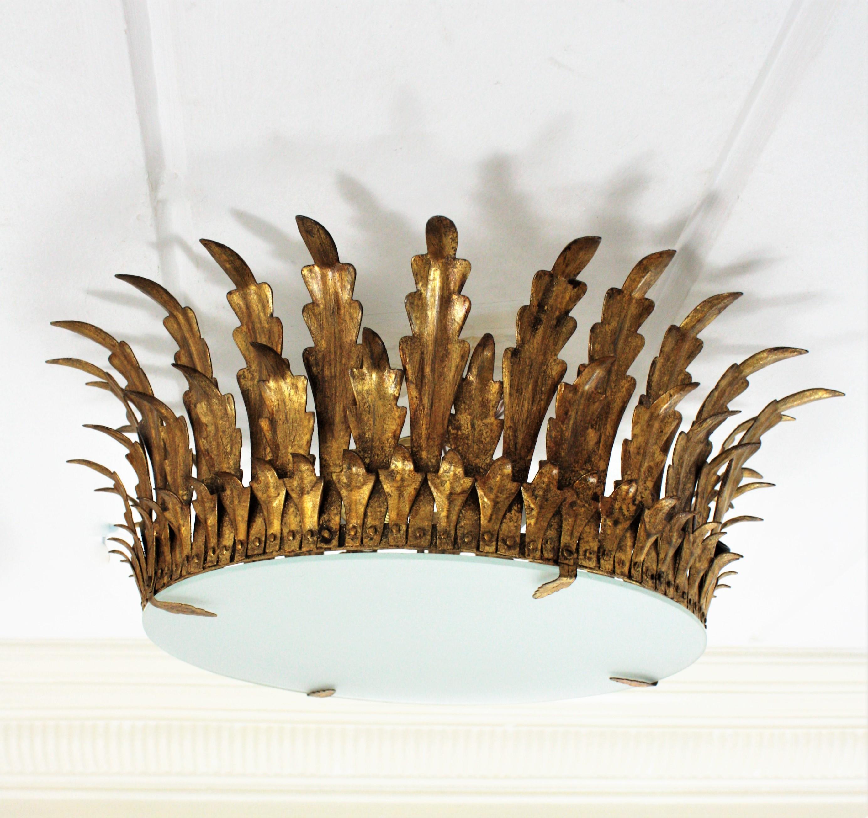 Frosted Pair of Large Sunburst Crown Flushmount Chandeliers in Wrought Gilt Iron For Sale