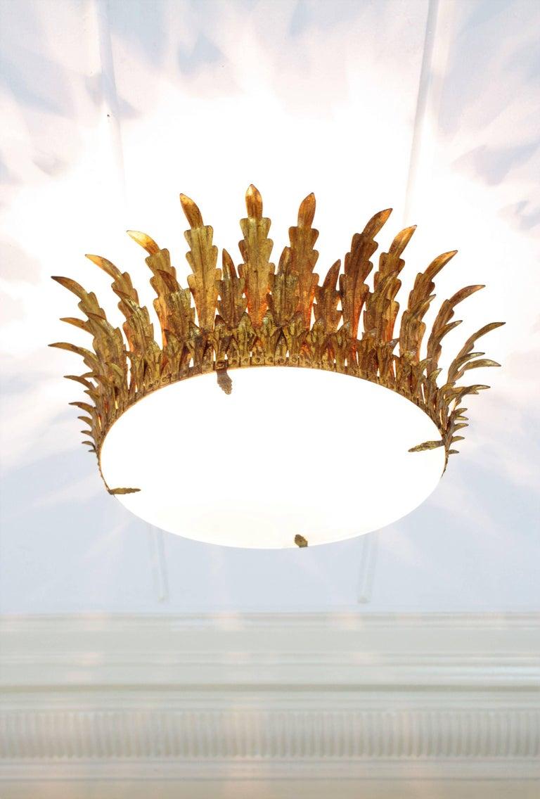 Pair of Large Sunburst Crown Flushmount Chandeliers in Wrought Gilt Iron For Sale 1
