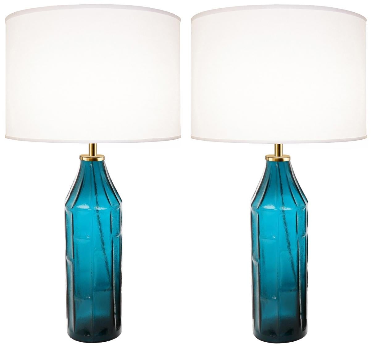 A pair of large oval teal blue glass lamps with brass hardware, Swedish, 1960s.