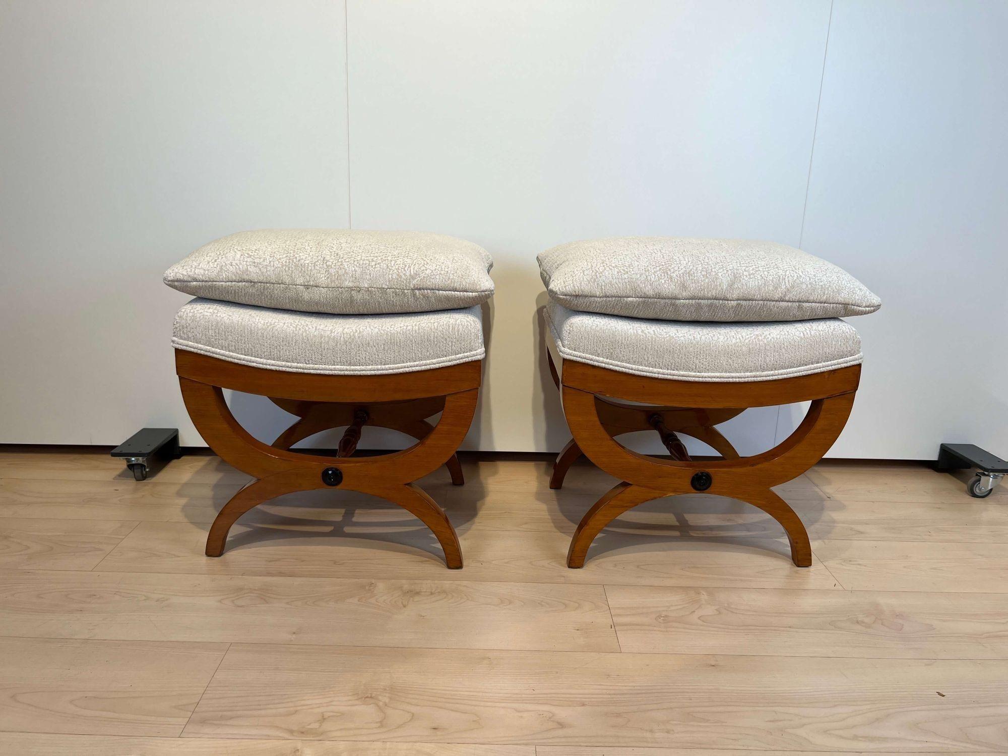 Beautiful pair of large french stools or tabouret from the mid 19th century.
Solid beech, partly ebonized. Restored and hand polished with shellac.
Newly upholstered and covered with cream and white mottled fabric and double keder.
Each stool comes