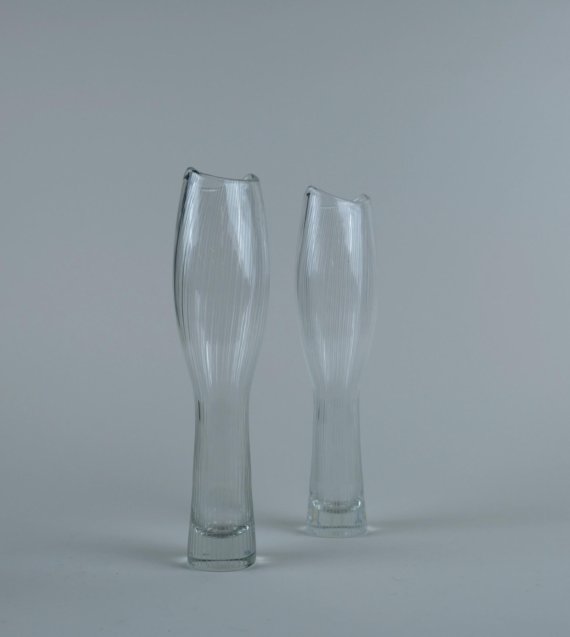 A pair of Tapio Wirkkala line-engraved art pieces model 3545. A bigger version of the smaller foal's leg (Varsanjalka in Finnish) vases. As Wirkkala was inspired by nature, these pieces are no exception as he drew his inspiration from the shape of a