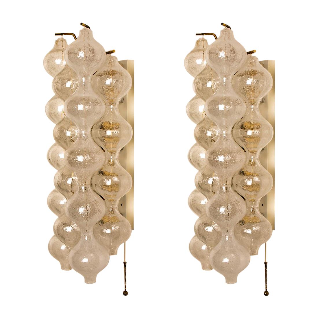 1 of the 8 unique large and elegant 'Tulipan' glass wall sconces by J.T. Kalmar, Austria, Vienna, manufactured in midcentury, circa 1970 (late 1960s or-early 1970s). Tulip shaped hand blown bubble glasses. With a white enameled metal frame which