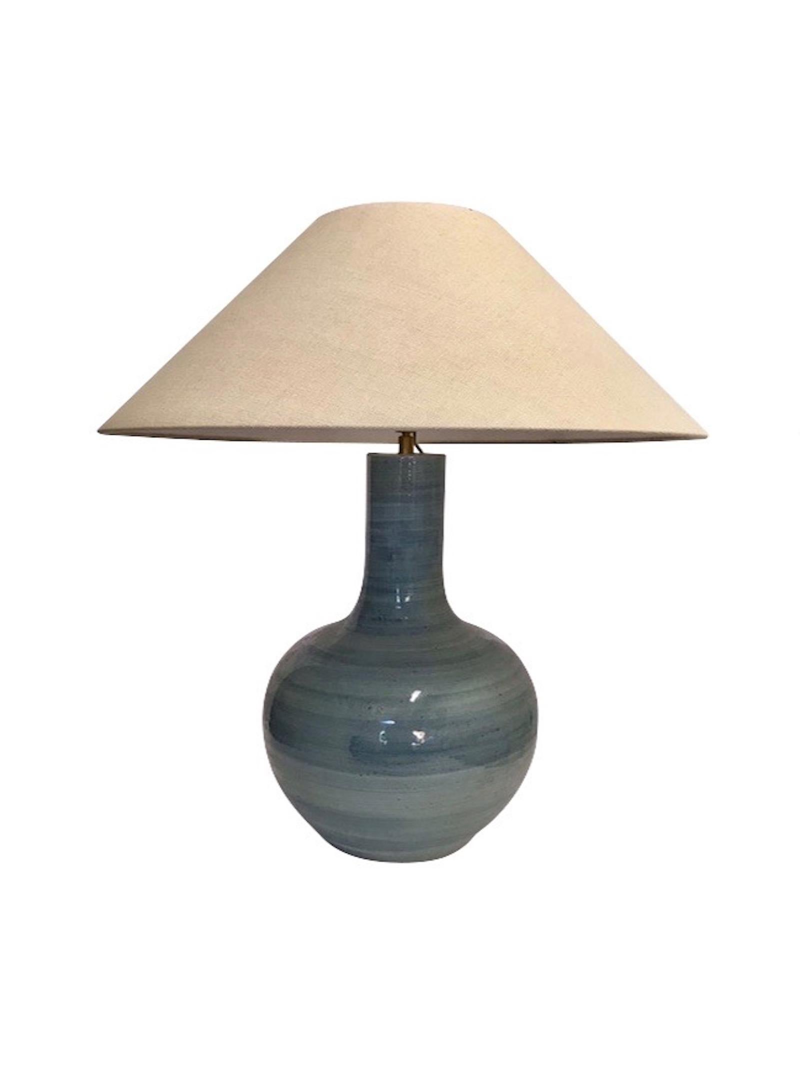 Pair of large turquoise terra cotta thin neck lamps.
Horizontal brush pattern.
Measures: Overall height including shade 28