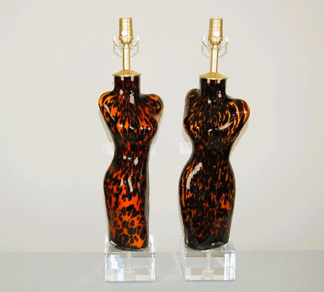 The Ladies’ are made of Murano glass, handblown into a mold. As such, the size and shape are identical, the markings vary somewhat. They are presented on large Lucite bases.

The lamps measure 26 inches from tabletop to socket top. As shown, the top