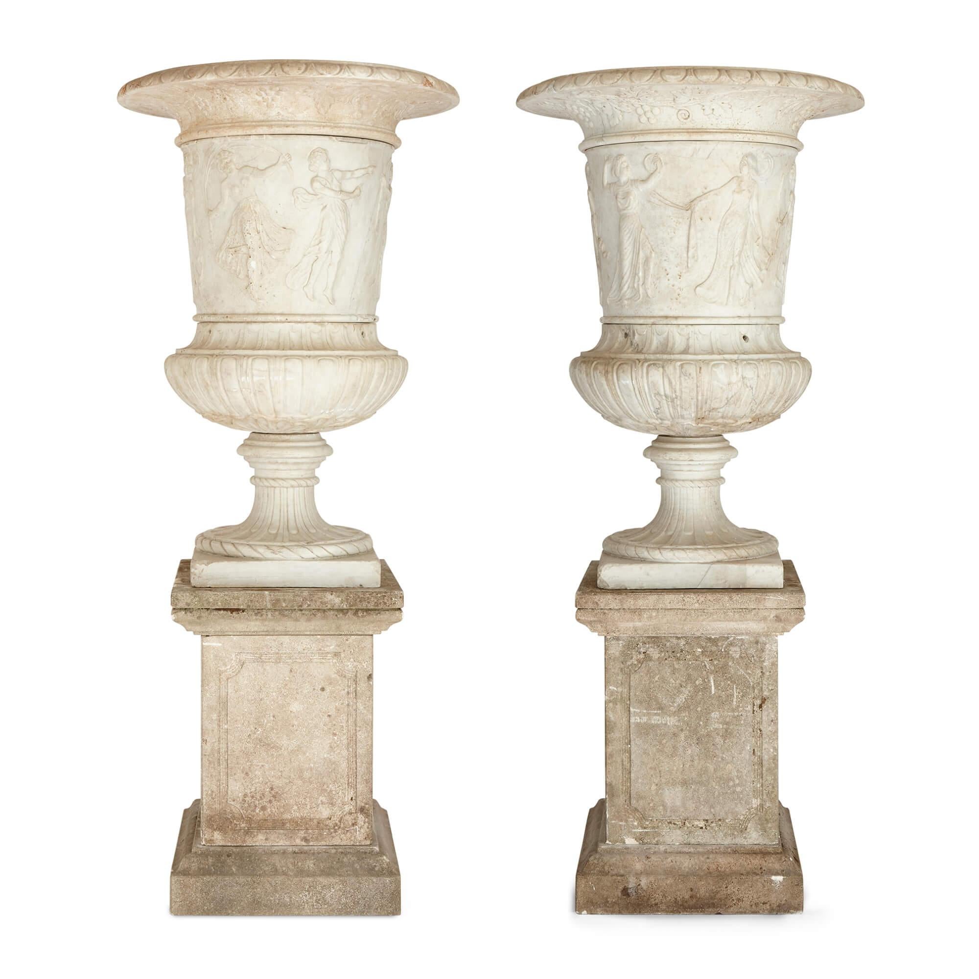 Pair of large, very fine carved marble garden urns of campana form with plinths
Continental, late 19th/early 20th century
Vases: height 100cm, diameter 69cm
Bases: height 62cm, width 44cm, depth 44cm

Monumental in scale and beautifully carved