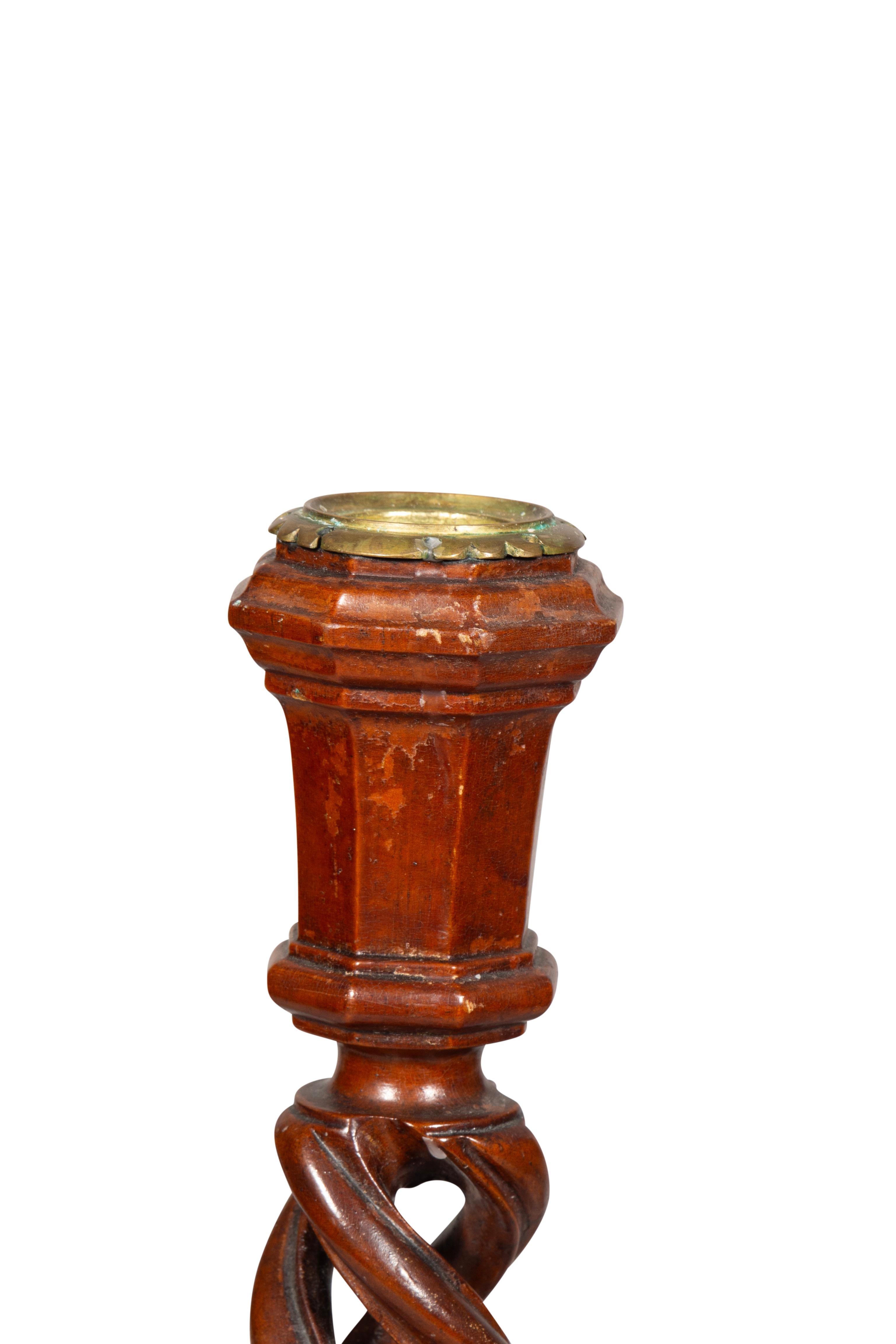 Each weighted and elaborately spiral carved with octagonal bases.