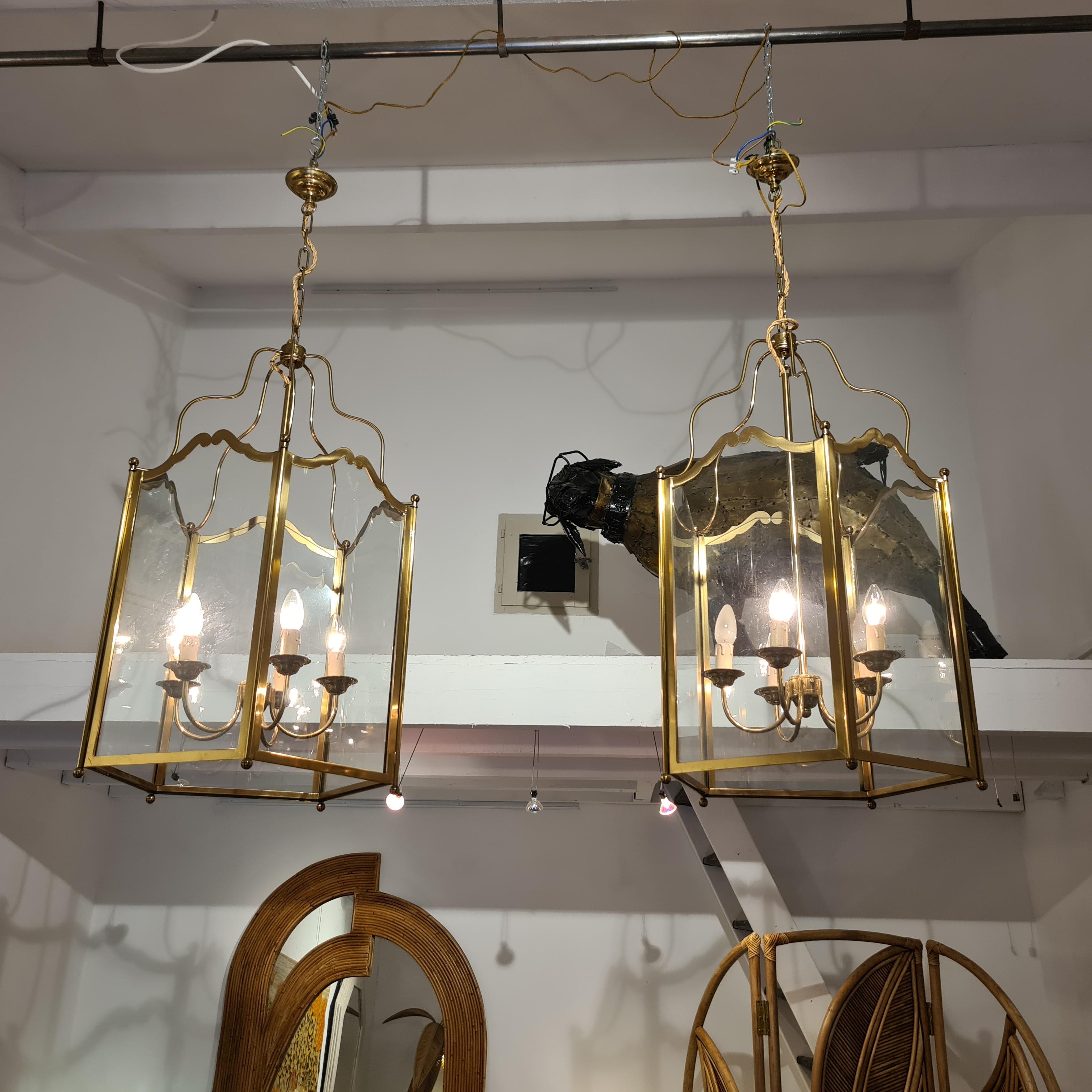 Pair of large vintage brass lanterns. In the style of Louis XVI. It is very rare to find a pair of this size. In the style of Maison Jansen..