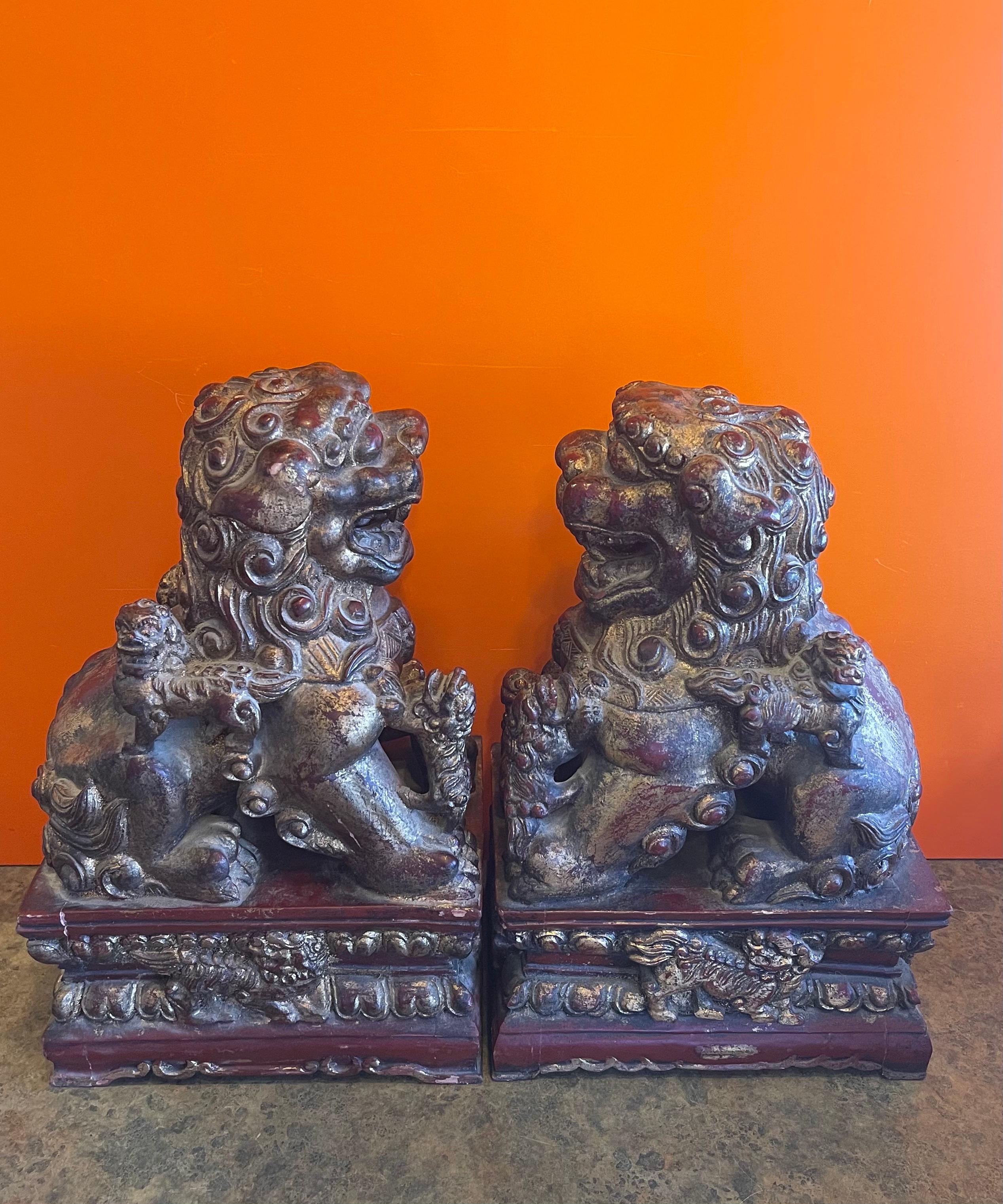Mid-Century Modern Pair of Large Vintage Chinese Hand Carved Gold Giltwood Foo Dogs For Sale