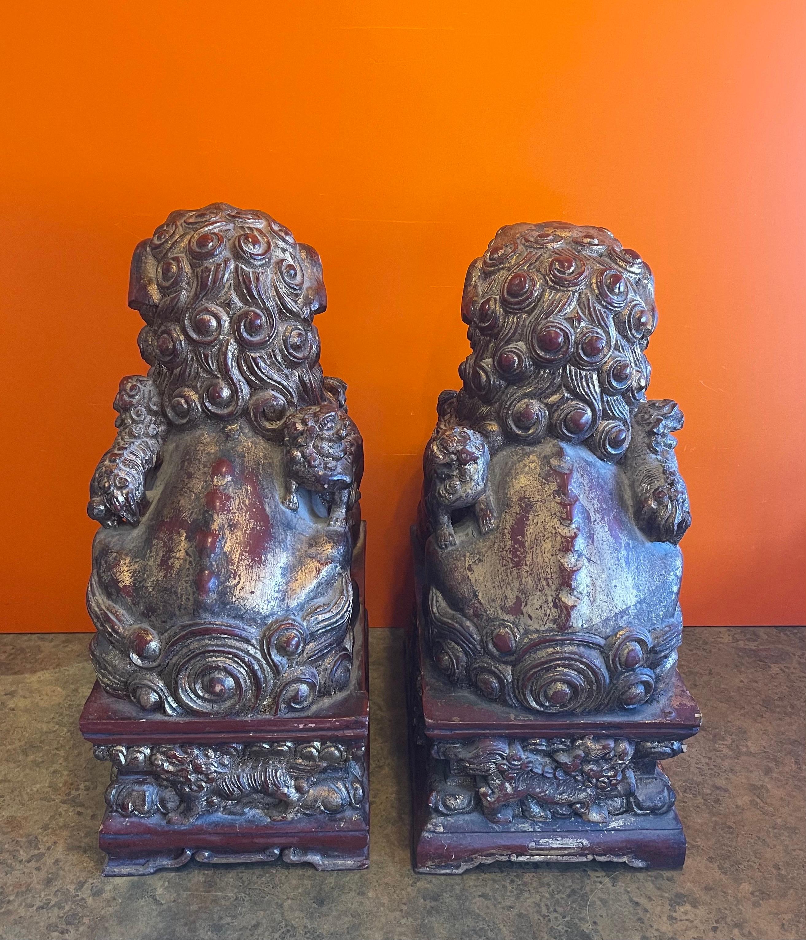 Hand-Carved Pair of Large Vintage Chinese Hand Carved Gold Giltwood Foo Dogs For Sale